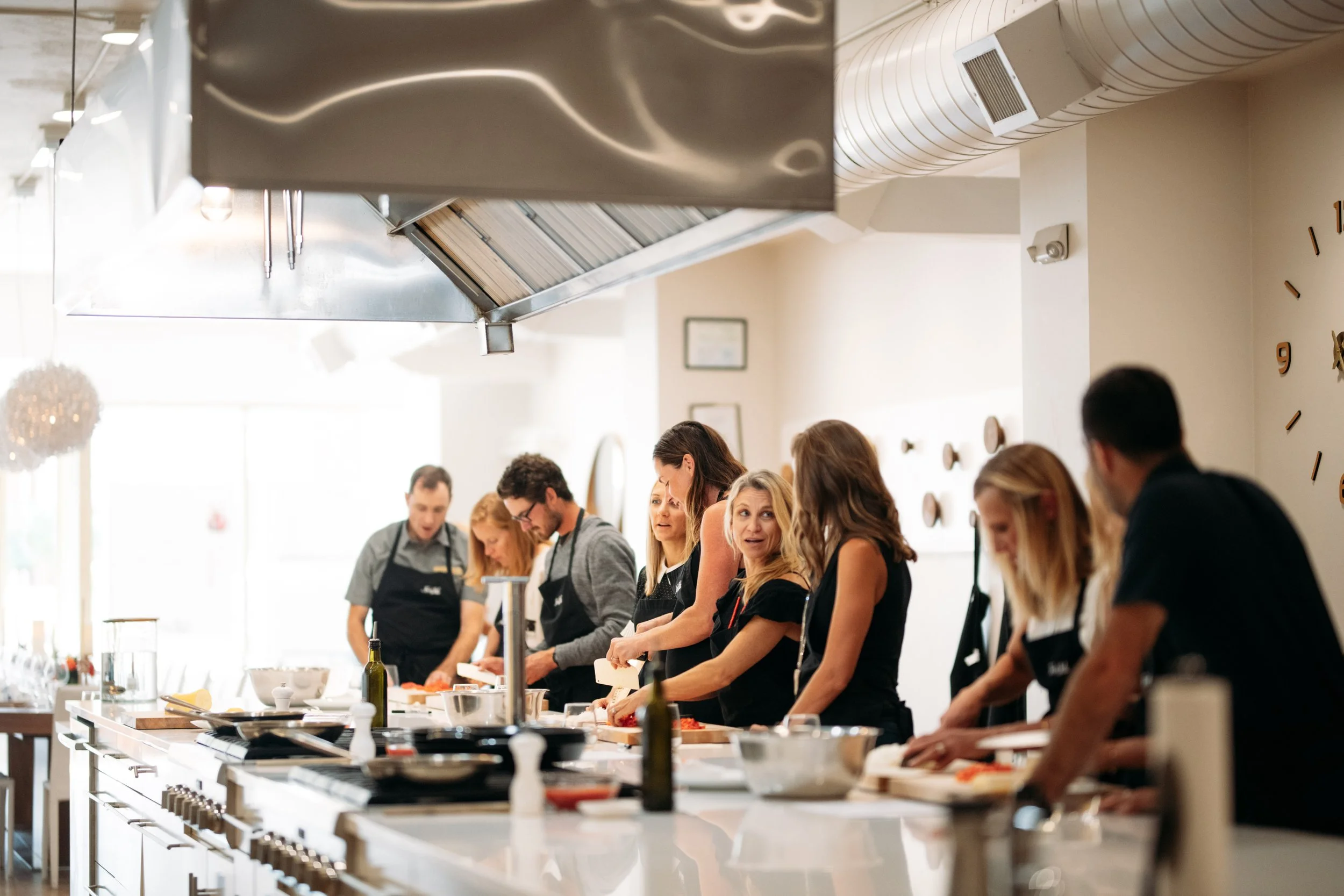 Guests cooking at Food Lab Corporate Team building event