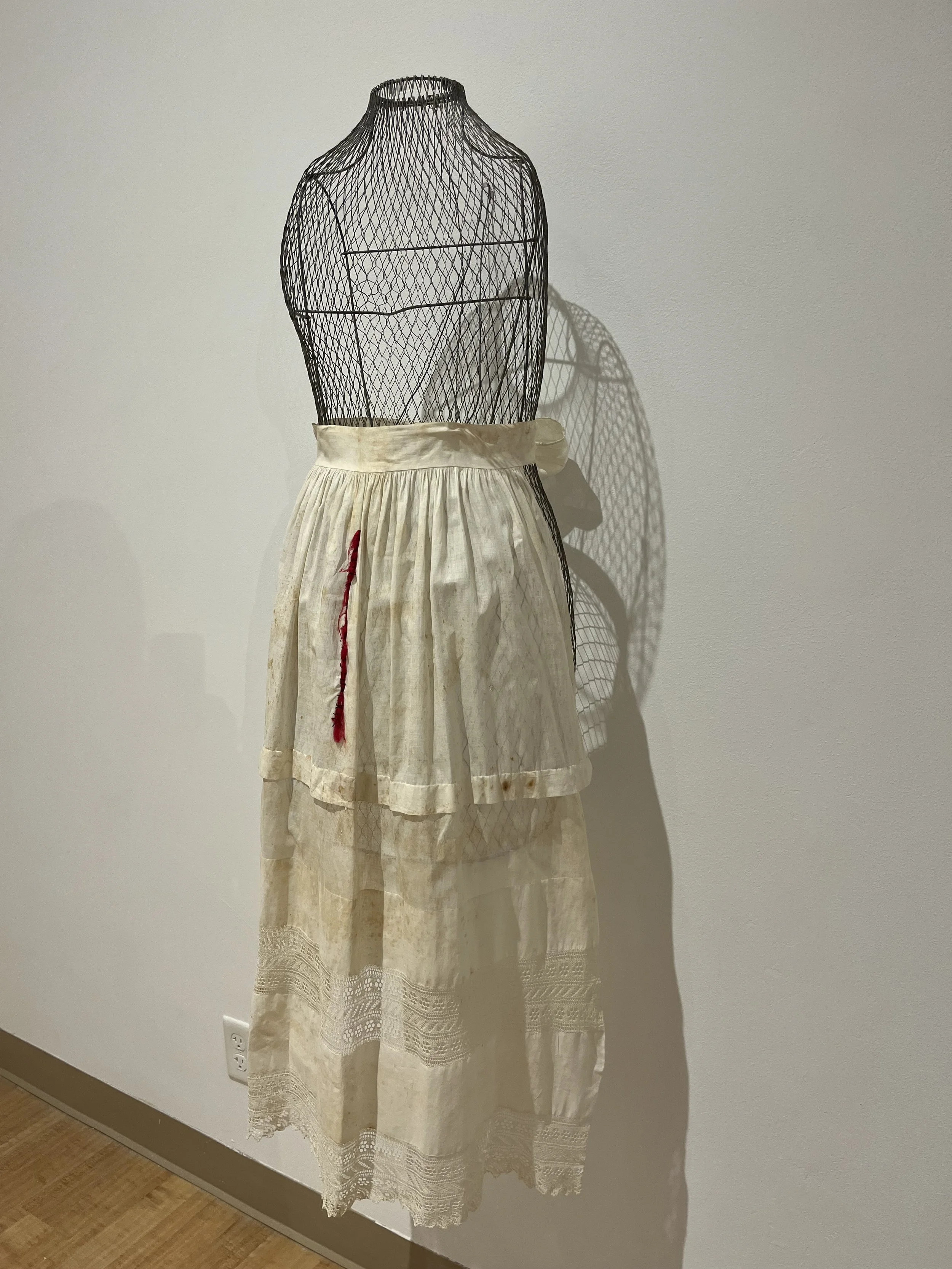 Apron Strings, vintage apron, mixed fibers, wire, 23.5 x 50 - Laura McCartney.jpg