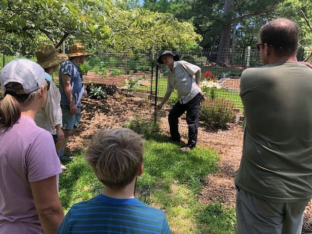  Andy Trawick gives a tour of his hillside garden on Timberlane.   Photo: Bart King 