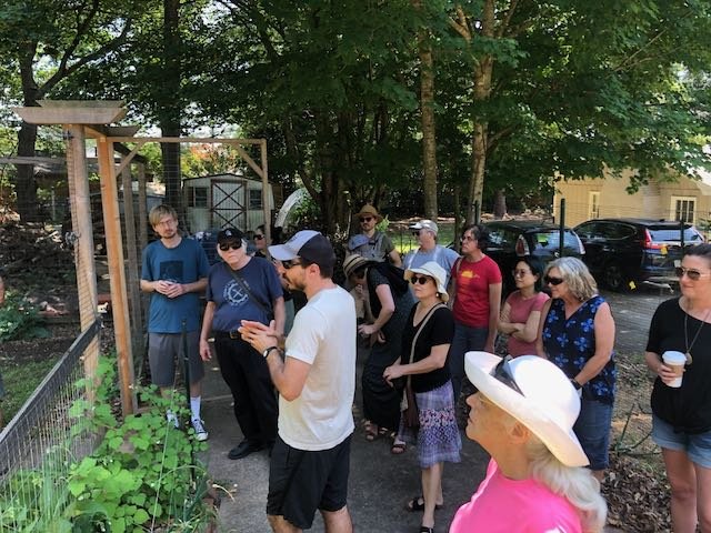  Kerem Kilic shows people his permaculture designs.   photo: Bart King 