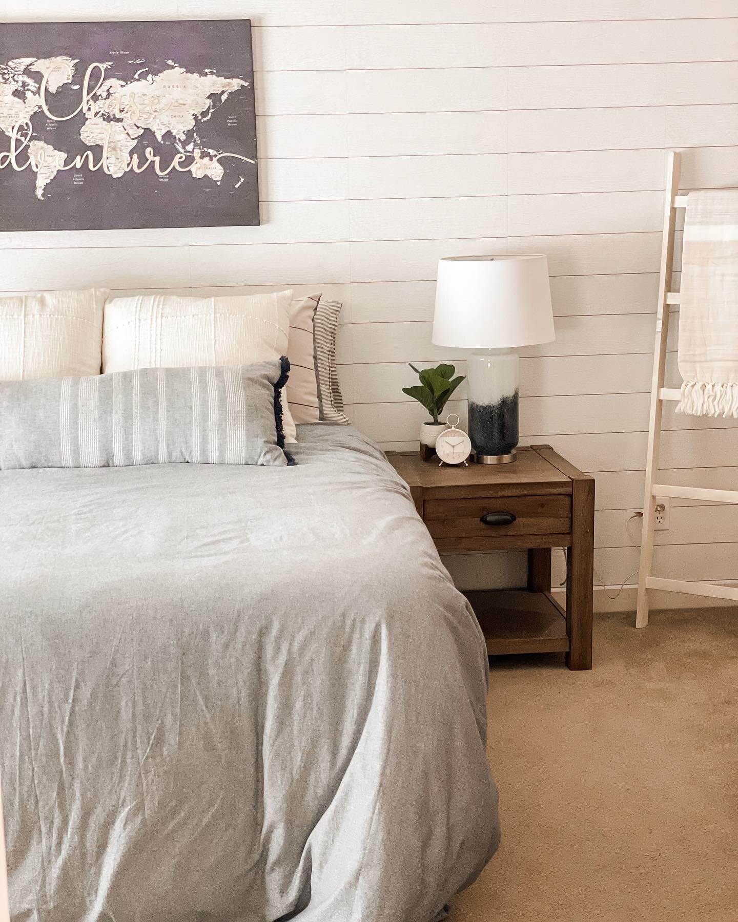 Swipe for before pics! My client wanted a peaceful and inviting bedroom with a mix of warm and cool colors. We decided on shiplap wallpaper to add some detail to the main wall. Love how it turned out! #beforeandafter #bedroommakeover #homedecor #inte