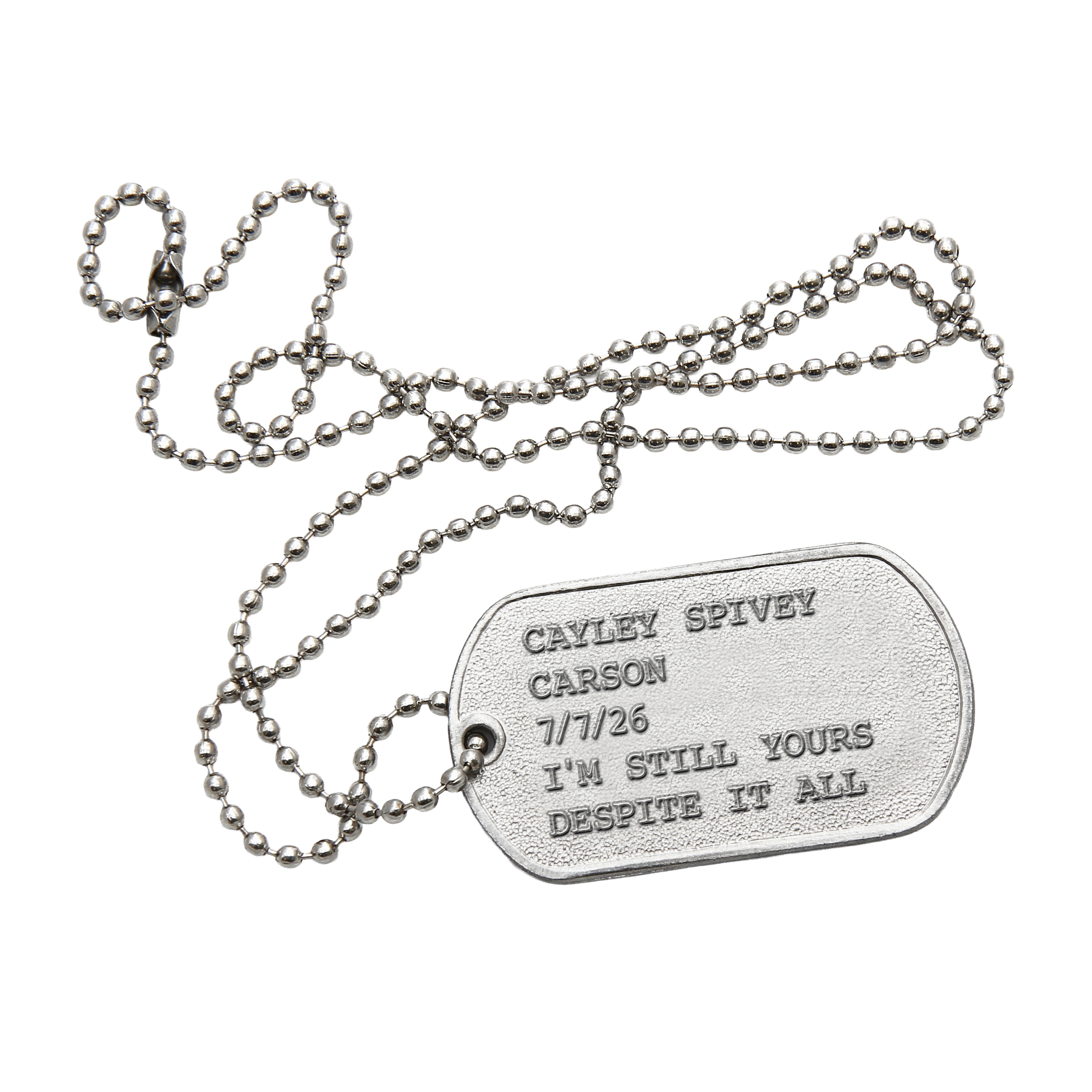 Silver dog tags with engraved text, attached to silver ball chain necklaces.