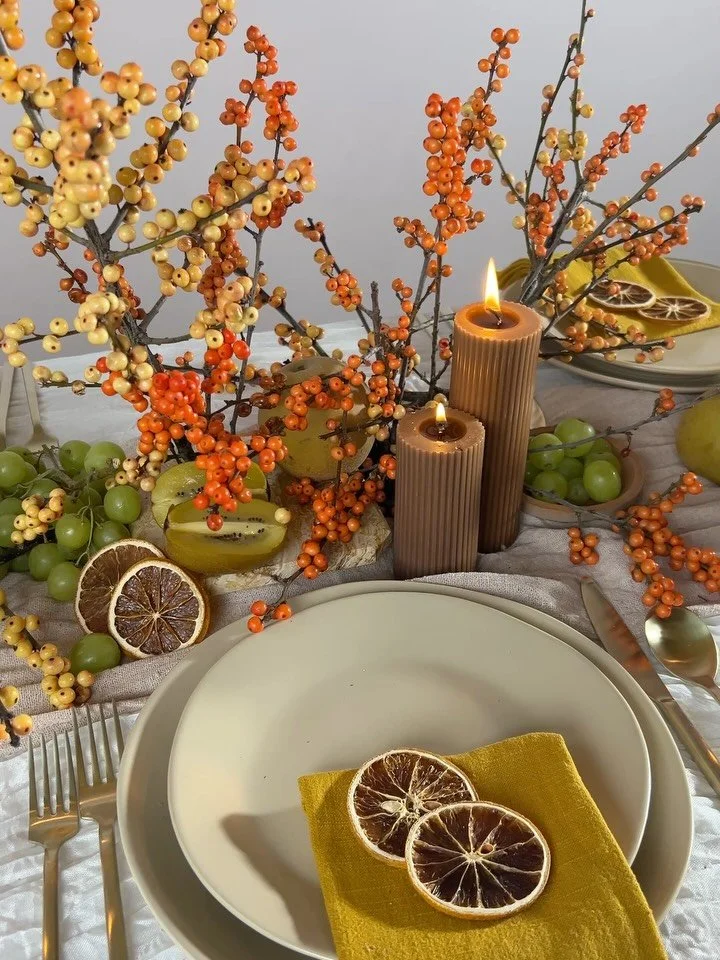 My intention when styling this holiday tablescape was to focus on seasonal ingredients while keeping the overall feeling warm and intimate. Designed using ilex branches, pome fruits, bundles of green grapes and pillar candles from @camiliasupply 

Th
