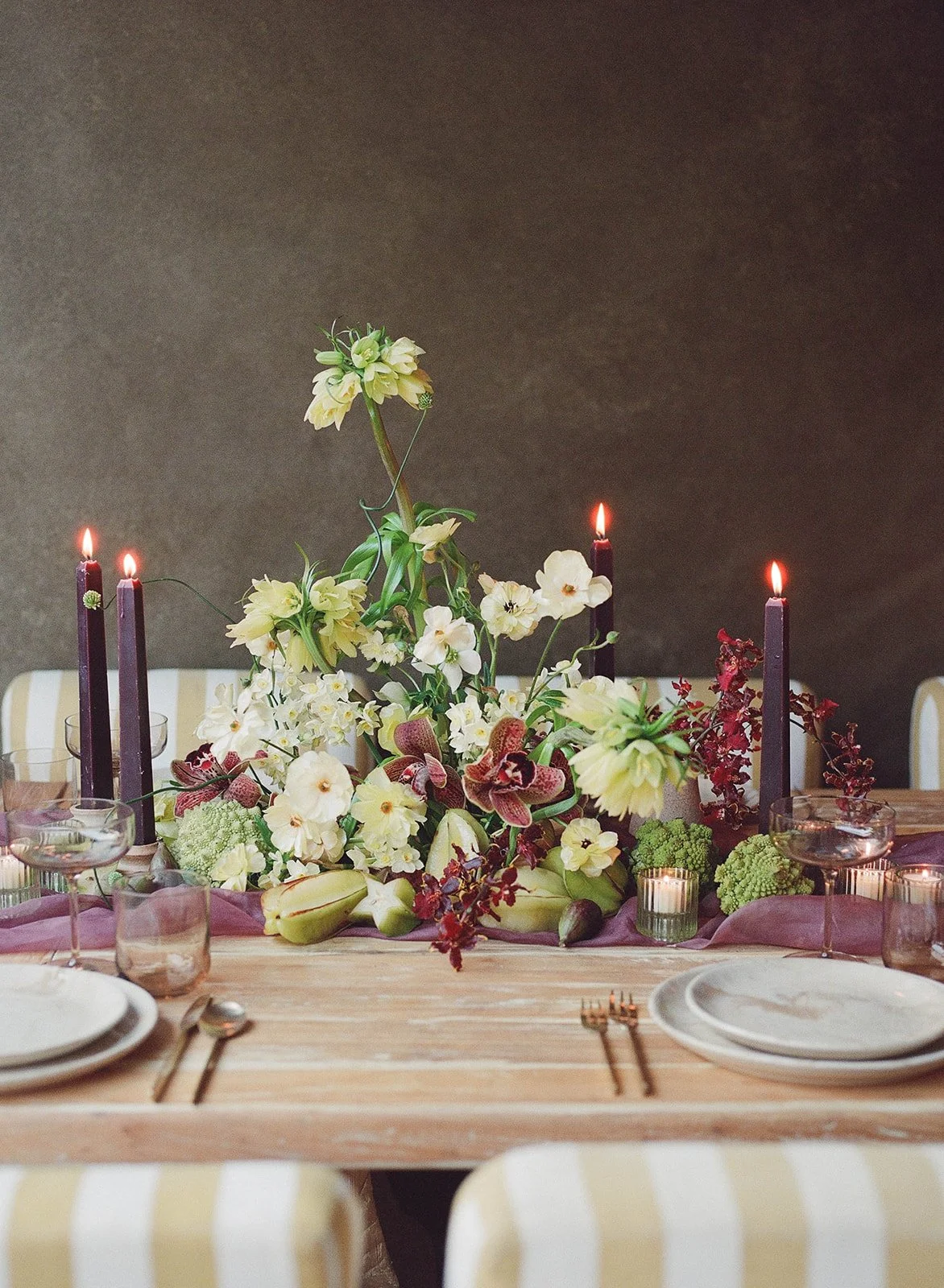Modern floral tablescape for weddings and events in burgundy and green color palette