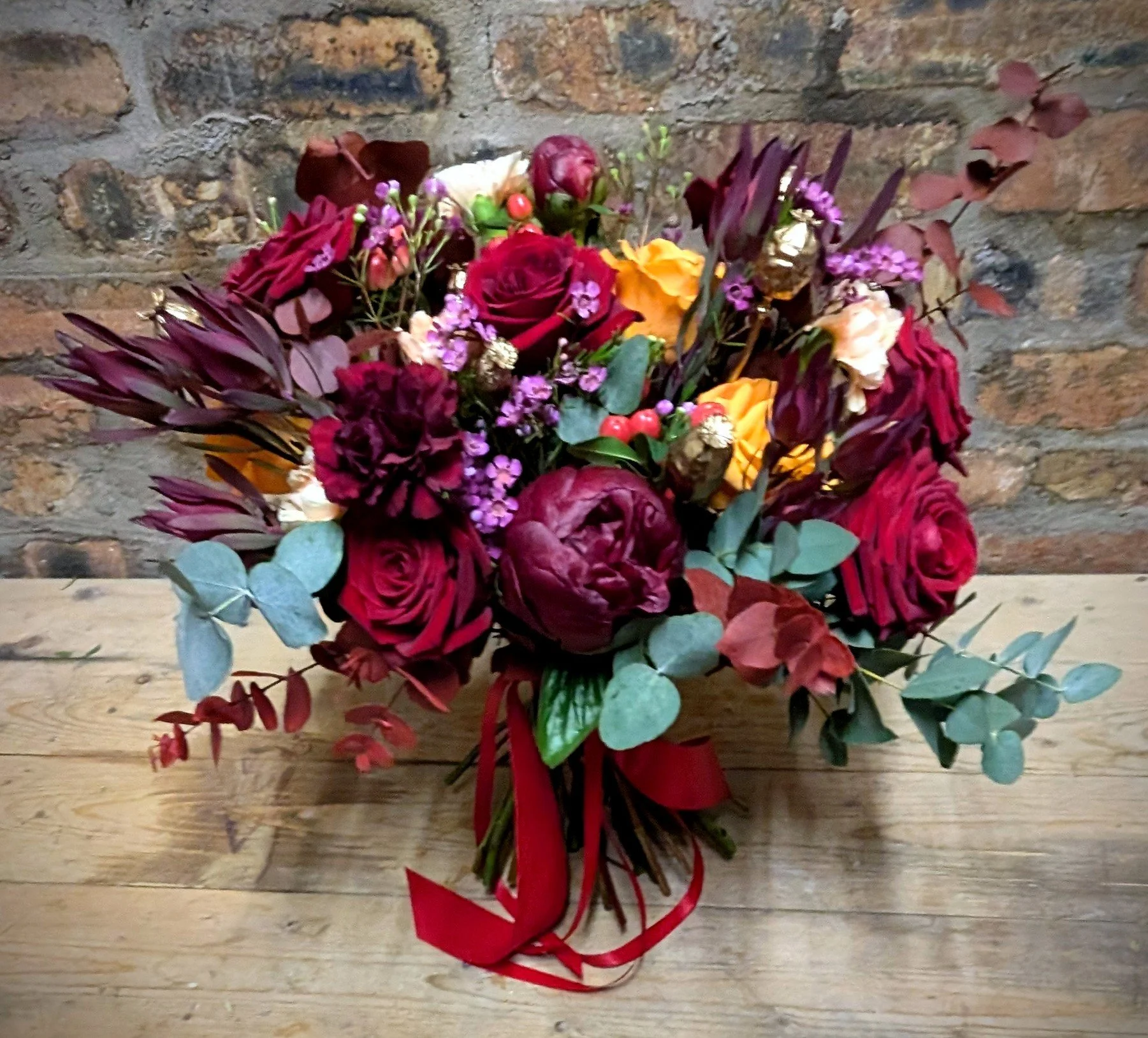 red and orange bridal bouquet