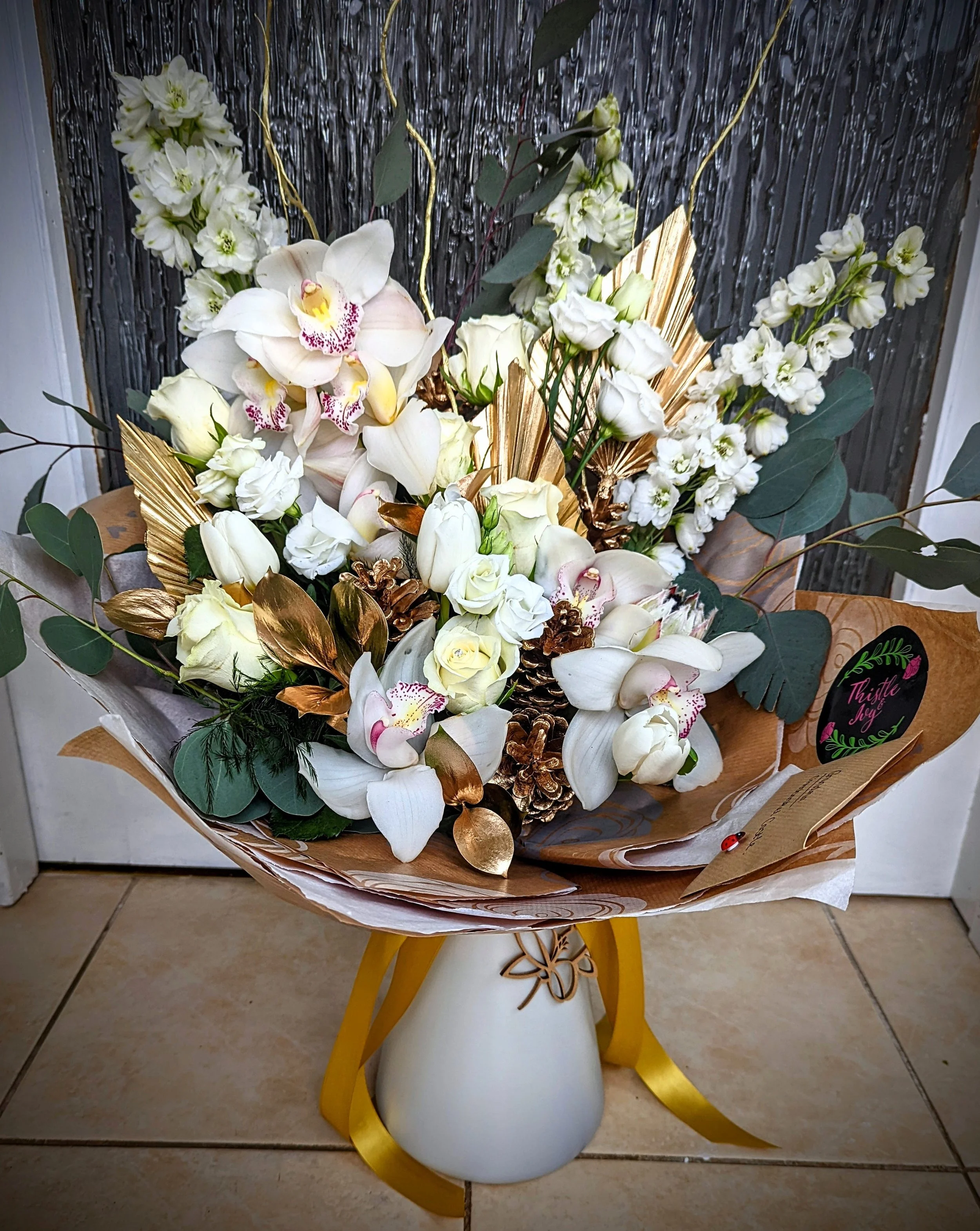 white rose and orchid luxury bouquet