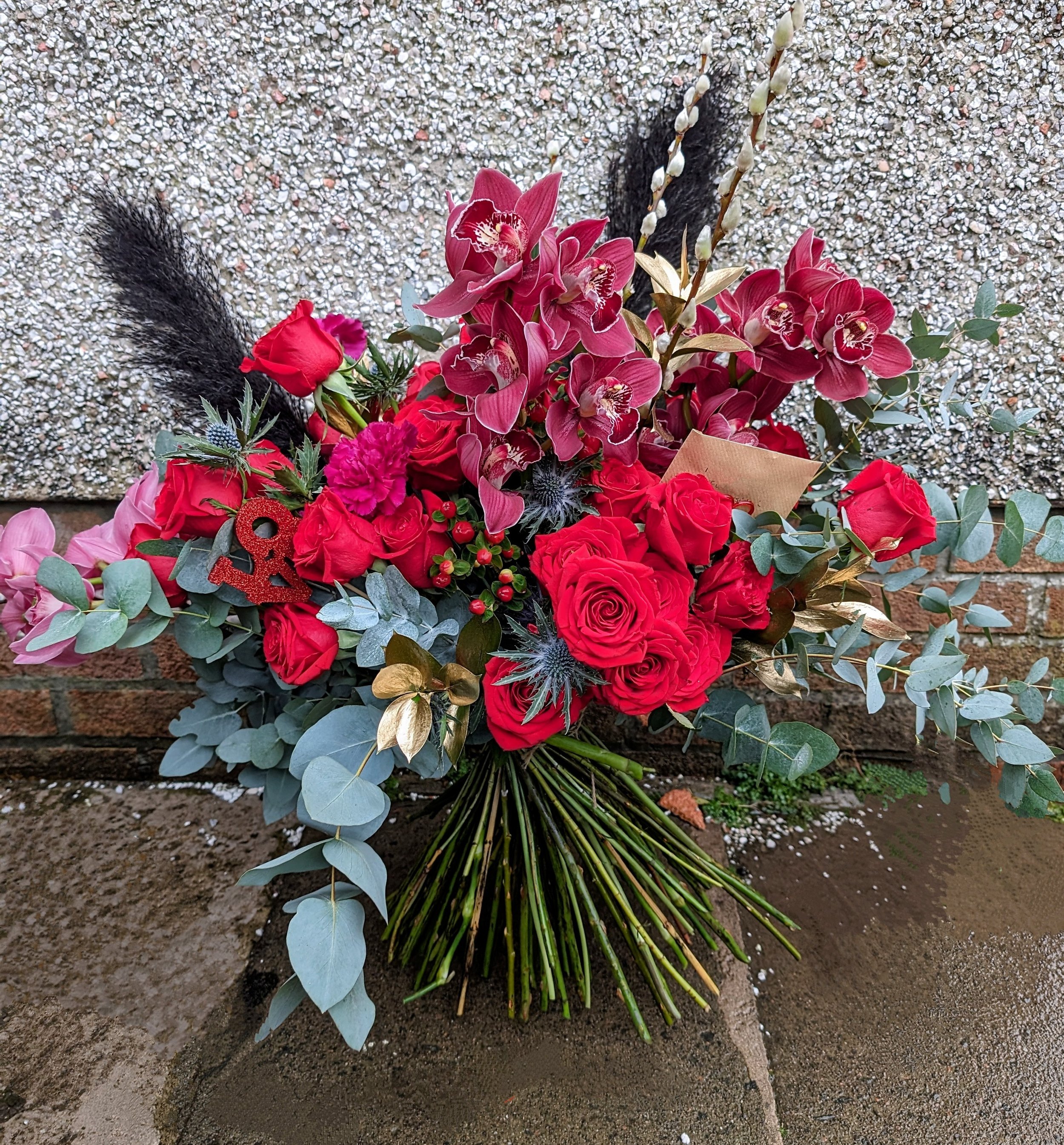 red roses with orchids