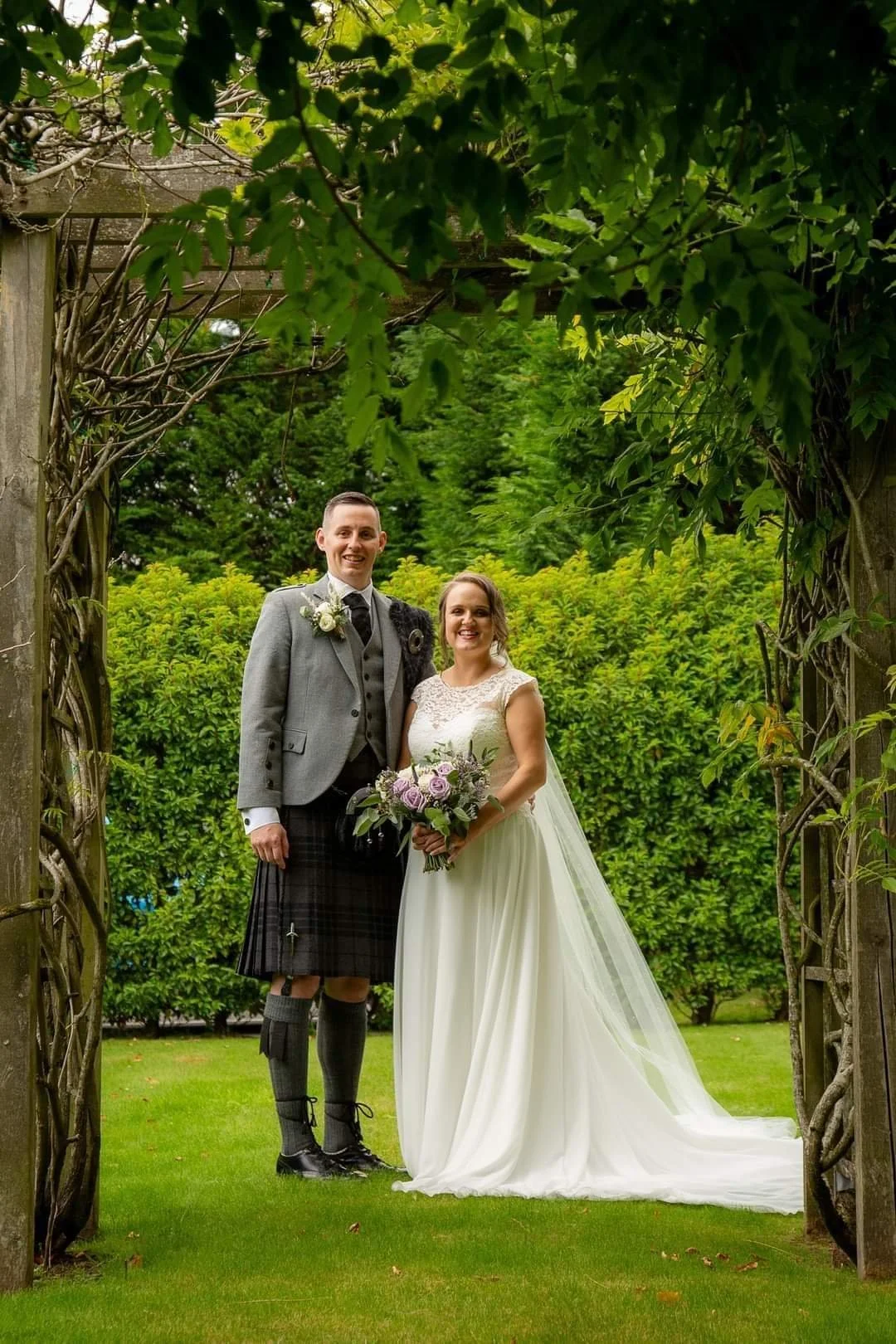 bride with lilac wedding bouquet