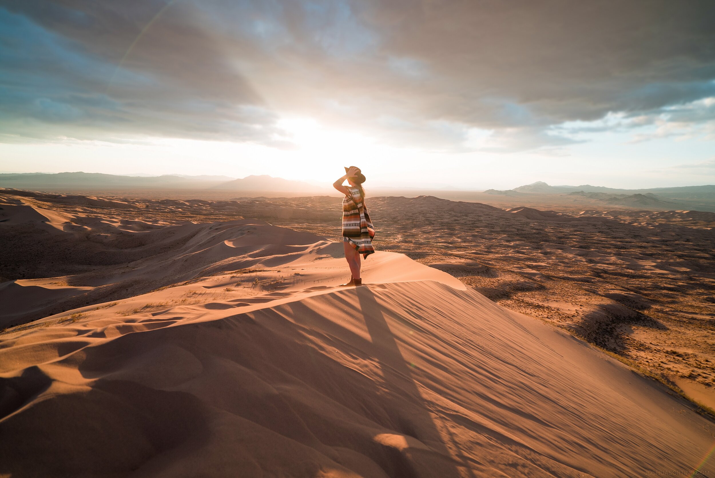 Woman on top of a dune in namibia