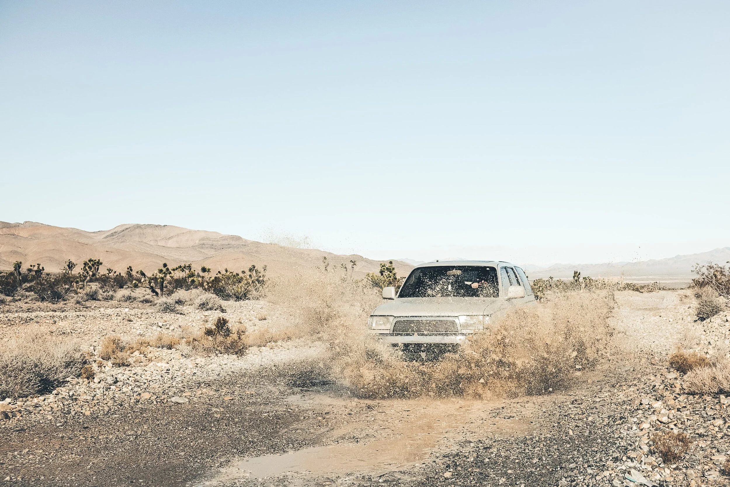 4x4 car driving through the mud in the desert of Namibia