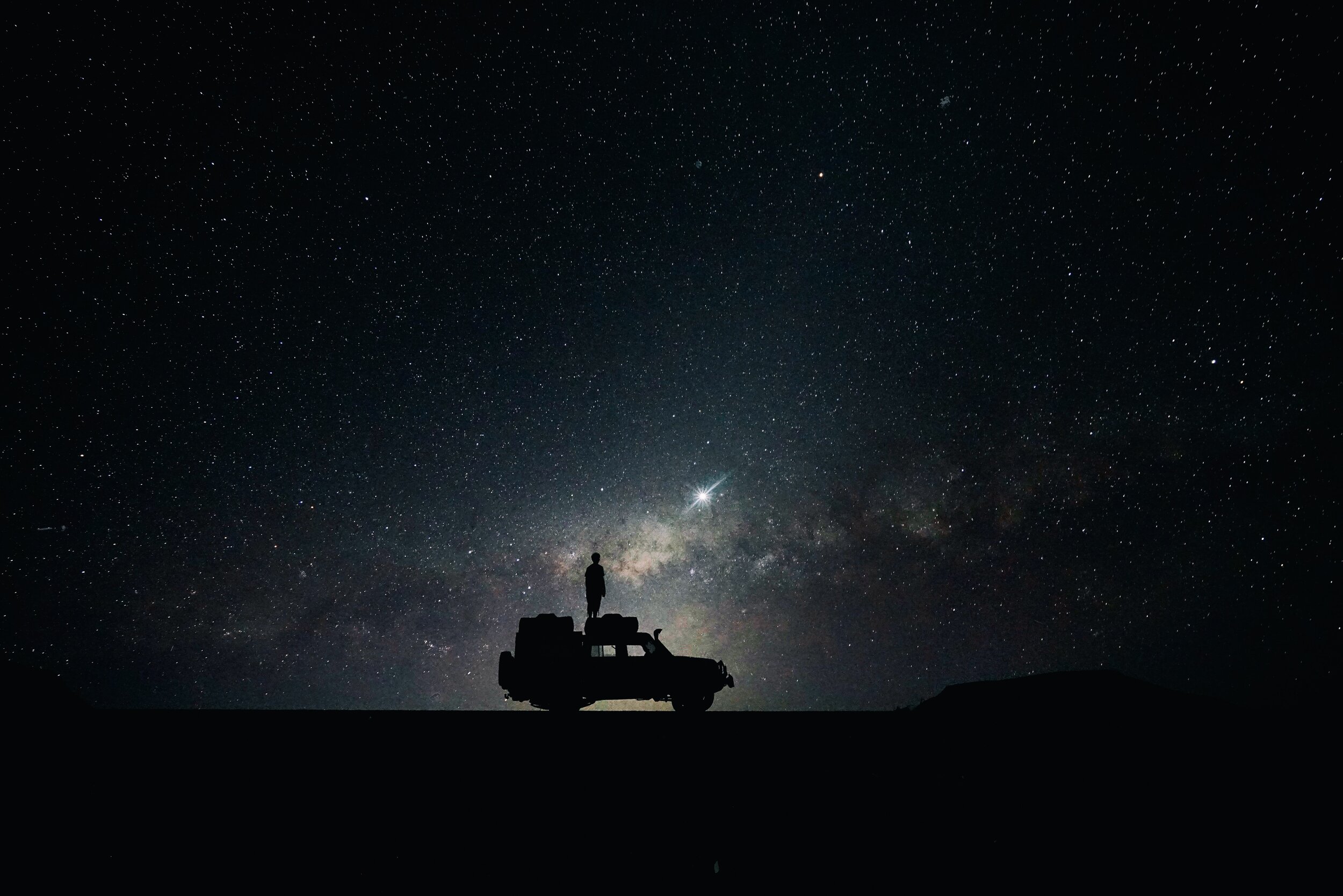 A stargazer stares up at the night sky in Sossusvlei.jpg