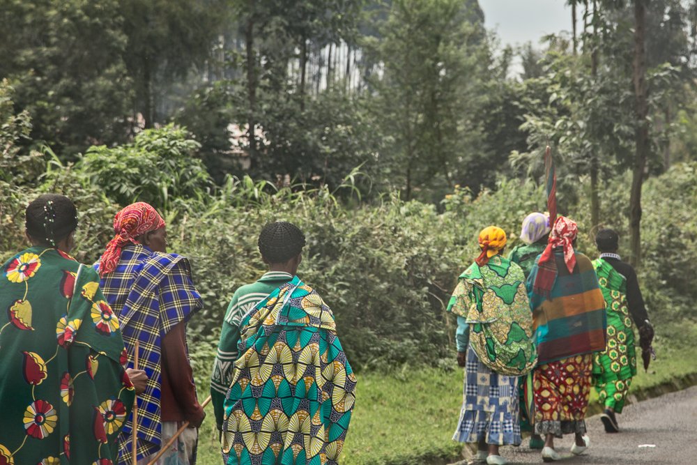 a group of Rwandan women walking in traditional garments in Rwanda