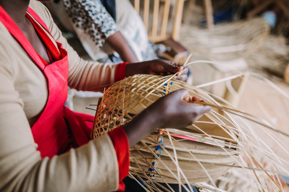 A woman weaving a basket in Rwanda
