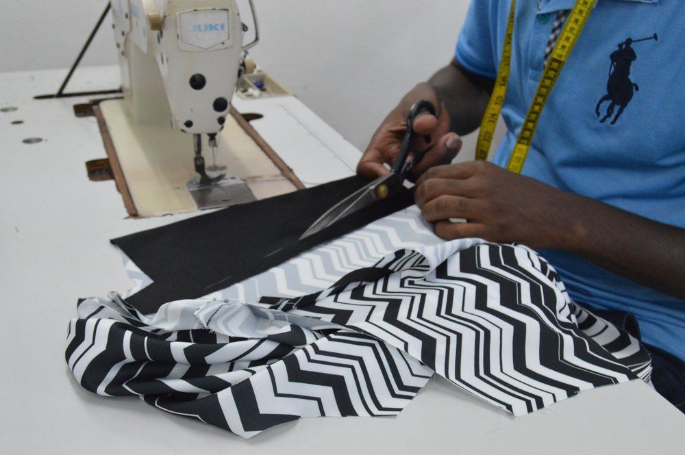 a modern day tailor in Rwanda