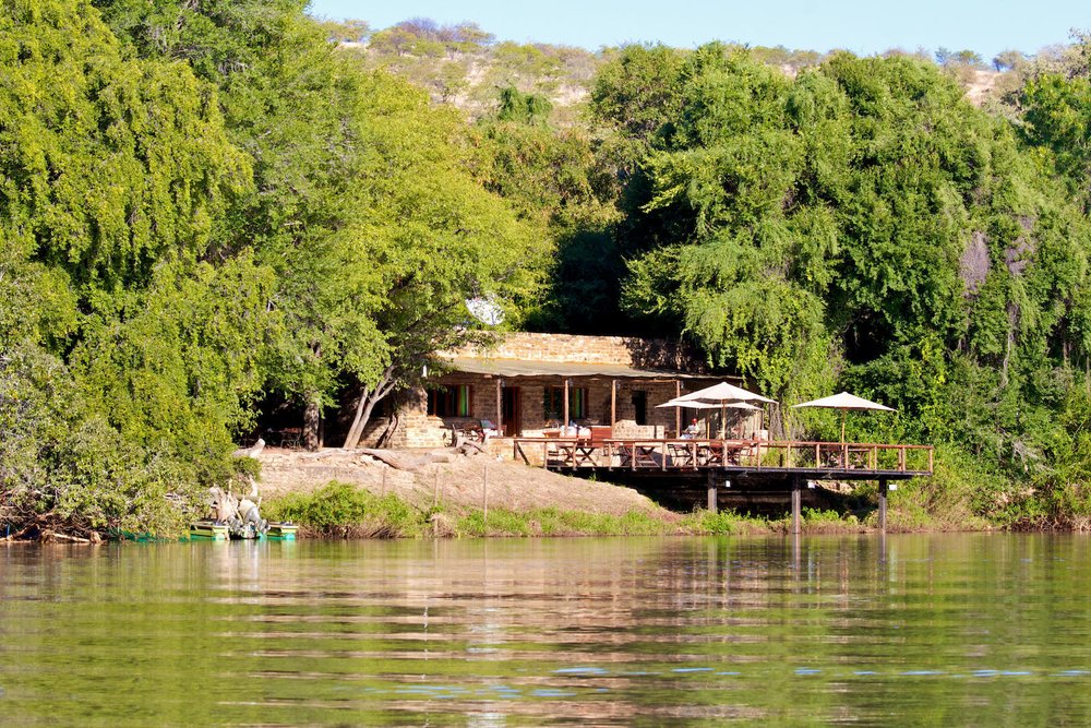 Kunene River Lodge exterior view next to river