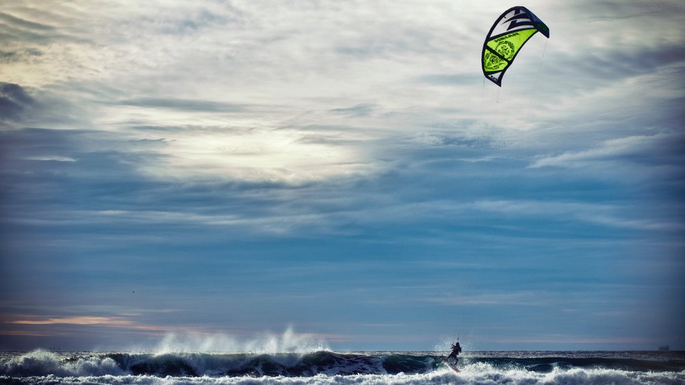 Person kite surfing on the ocean