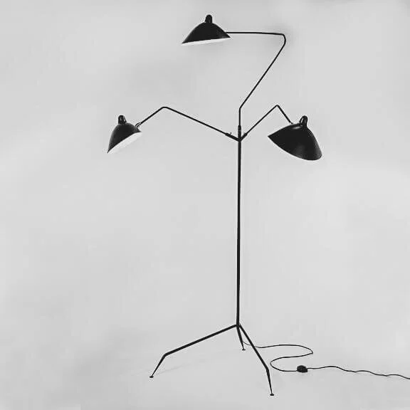 Serge Mouille three-arm floor lamp with black articulated arms and metal shades