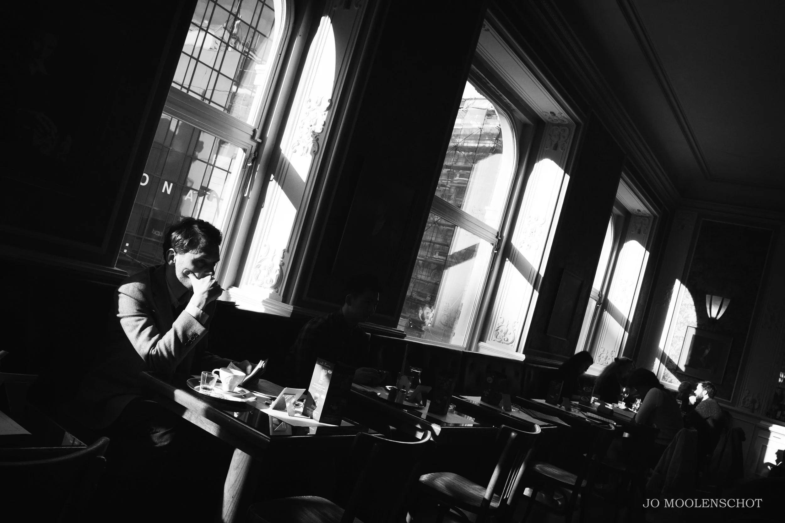 Man in restaurant Prague Jo Moolenschot Travel Photography.JPG