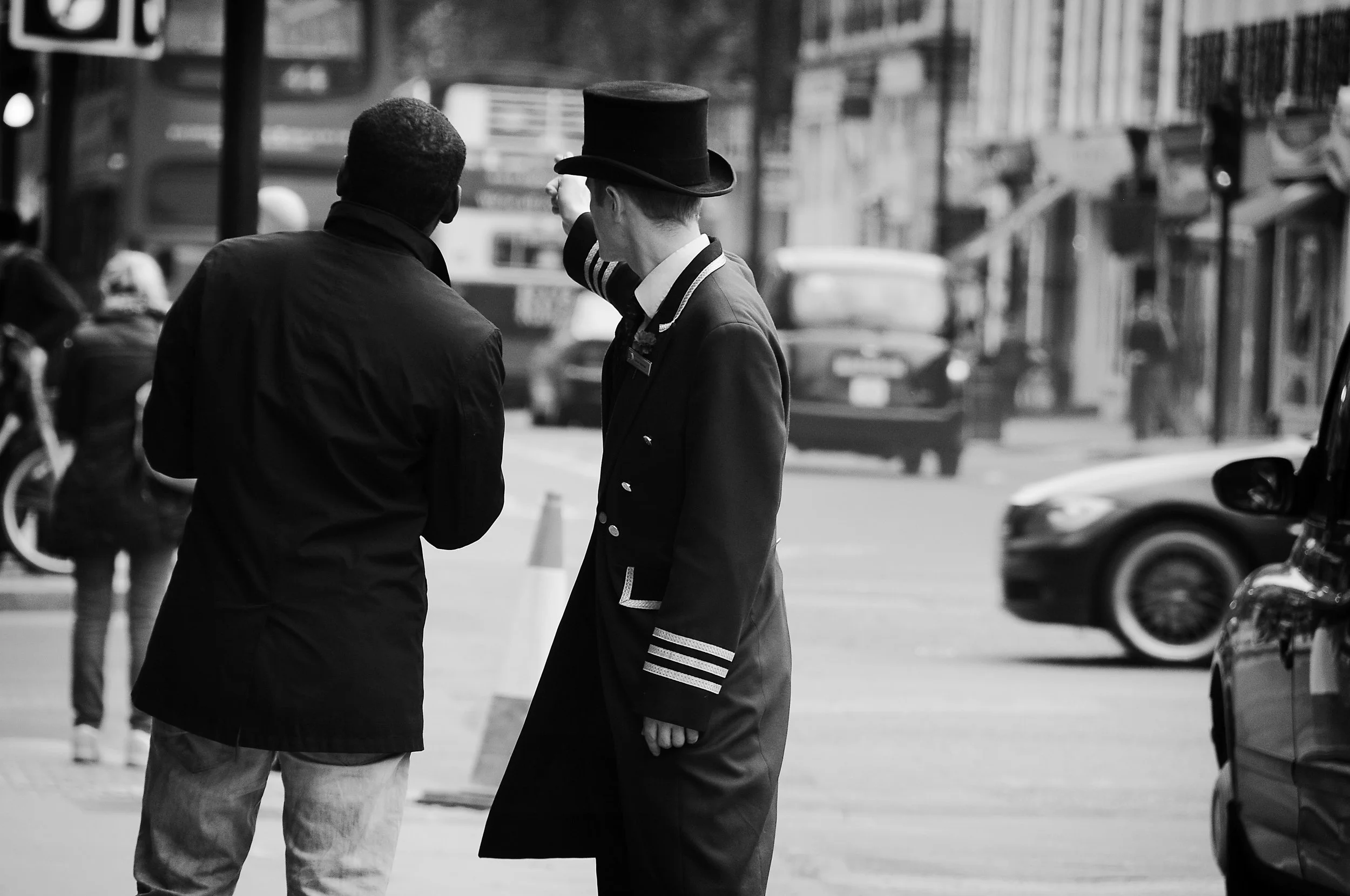 Porter giving directions London street photography.jpg