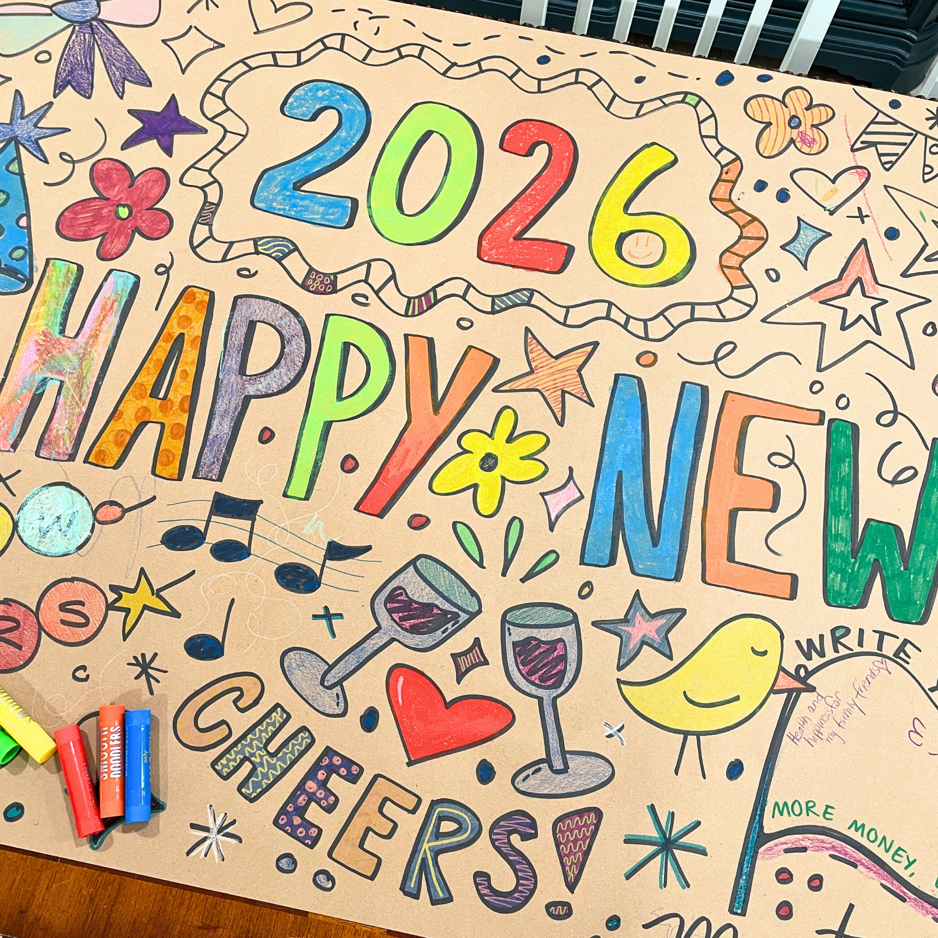 Colorful poster with the year 2026, celebrating a new year with drawings of flowers, stars, musical notes, wine glasses, a heart, a bird, and celebratory text reading "Happy New Year" and "Cheers!"
