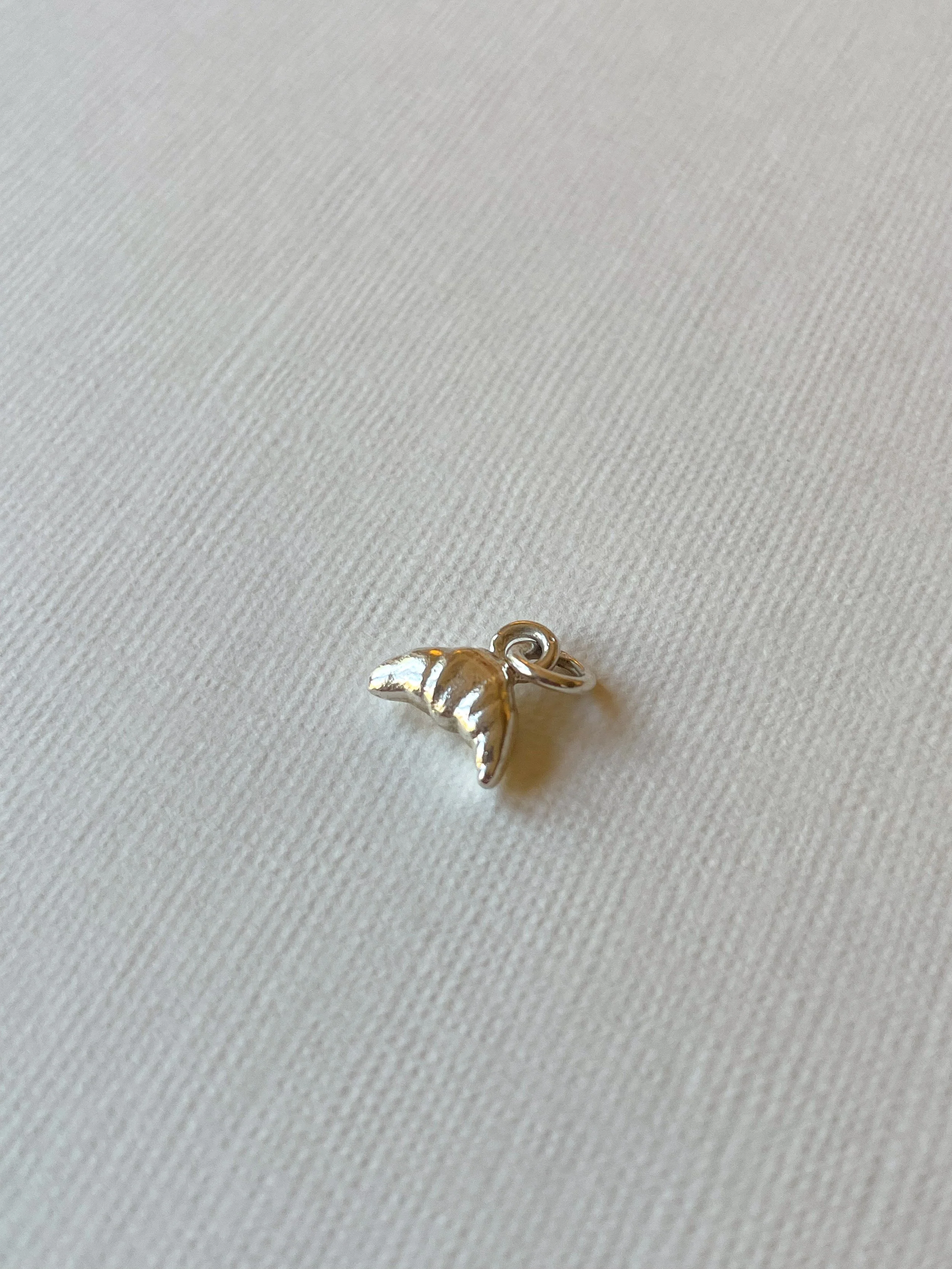 Sterling silver teeny croissant charm