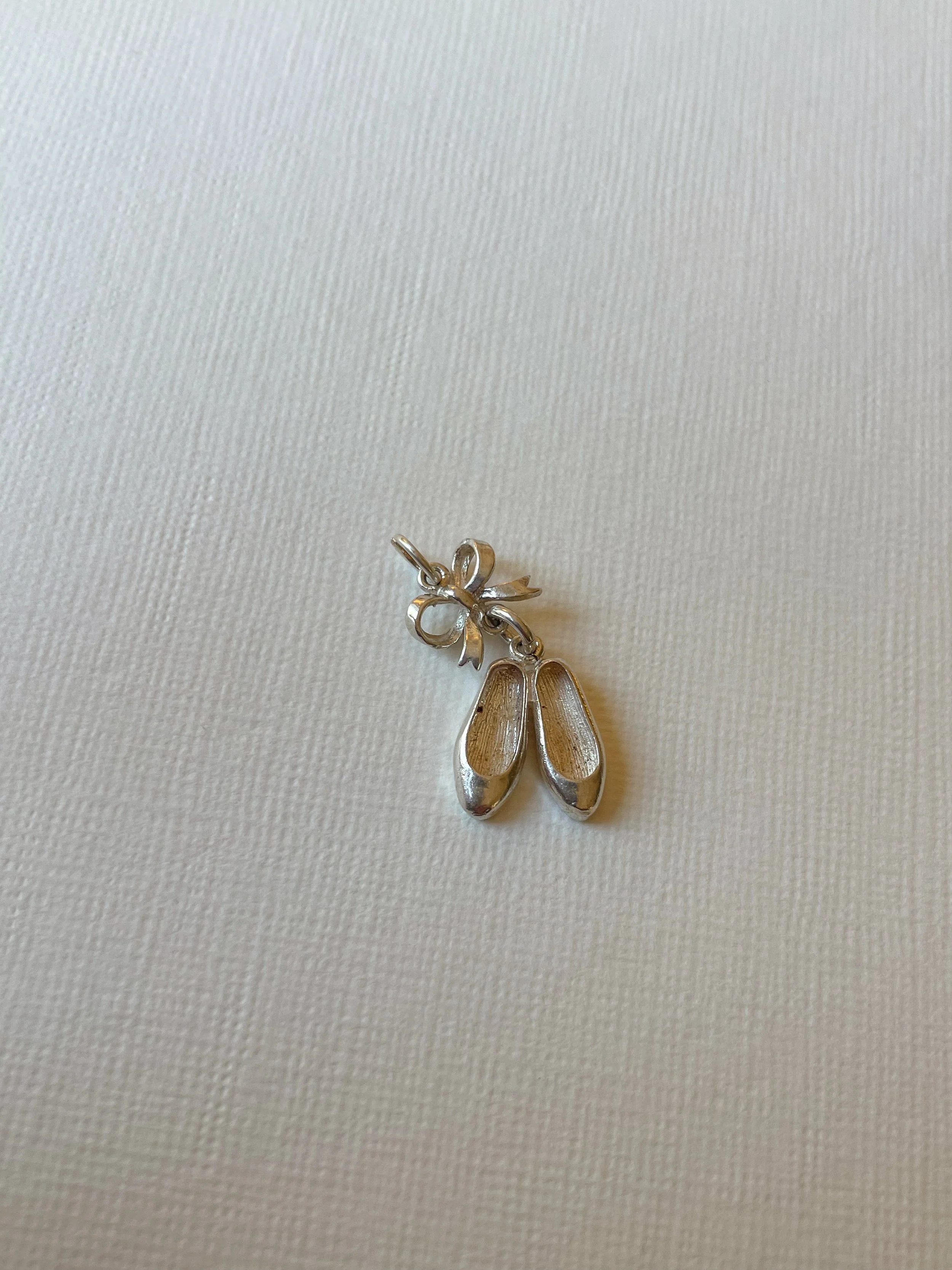 Sterling silver ballet shoes and bow charm