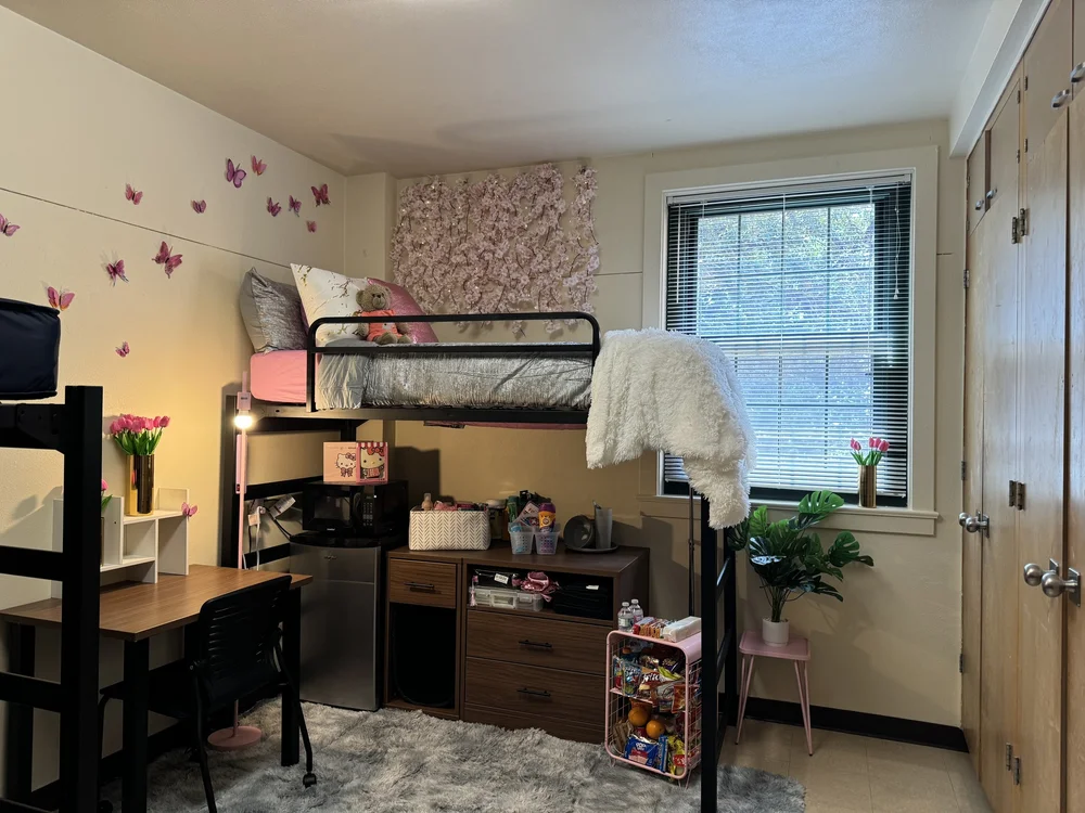 Bedding and dorm essentials laid out before move-in