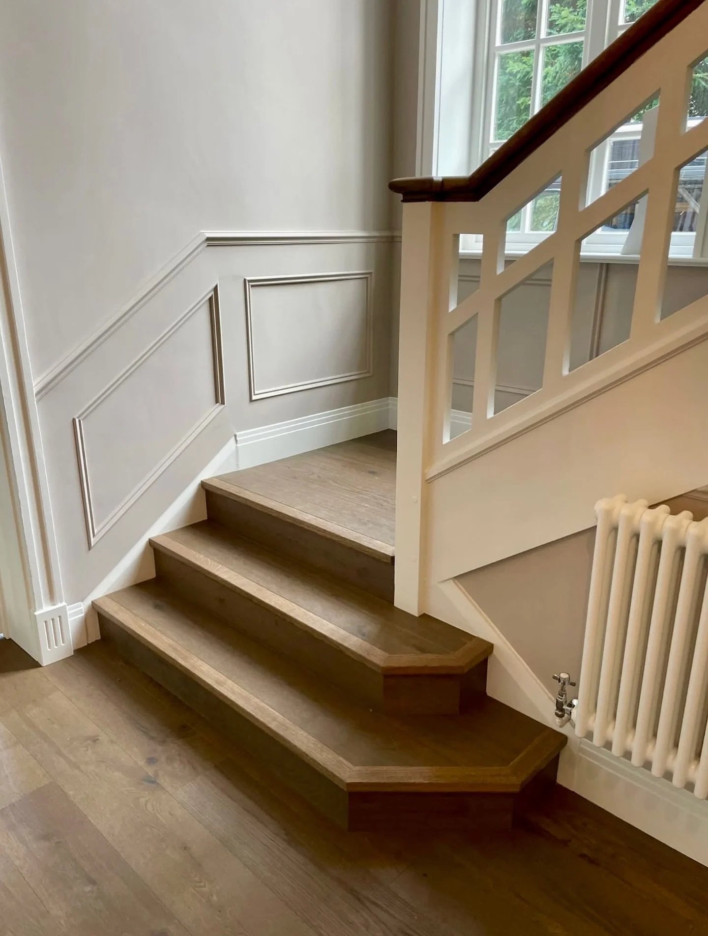 It&rsquo;s the details that make a home unforgettable.

This corner was transformed from simple and plain into a statement of style and function. With bespoke wall panelling crafted by one of our skilled carpenters and oak steps, Sadie brought it all