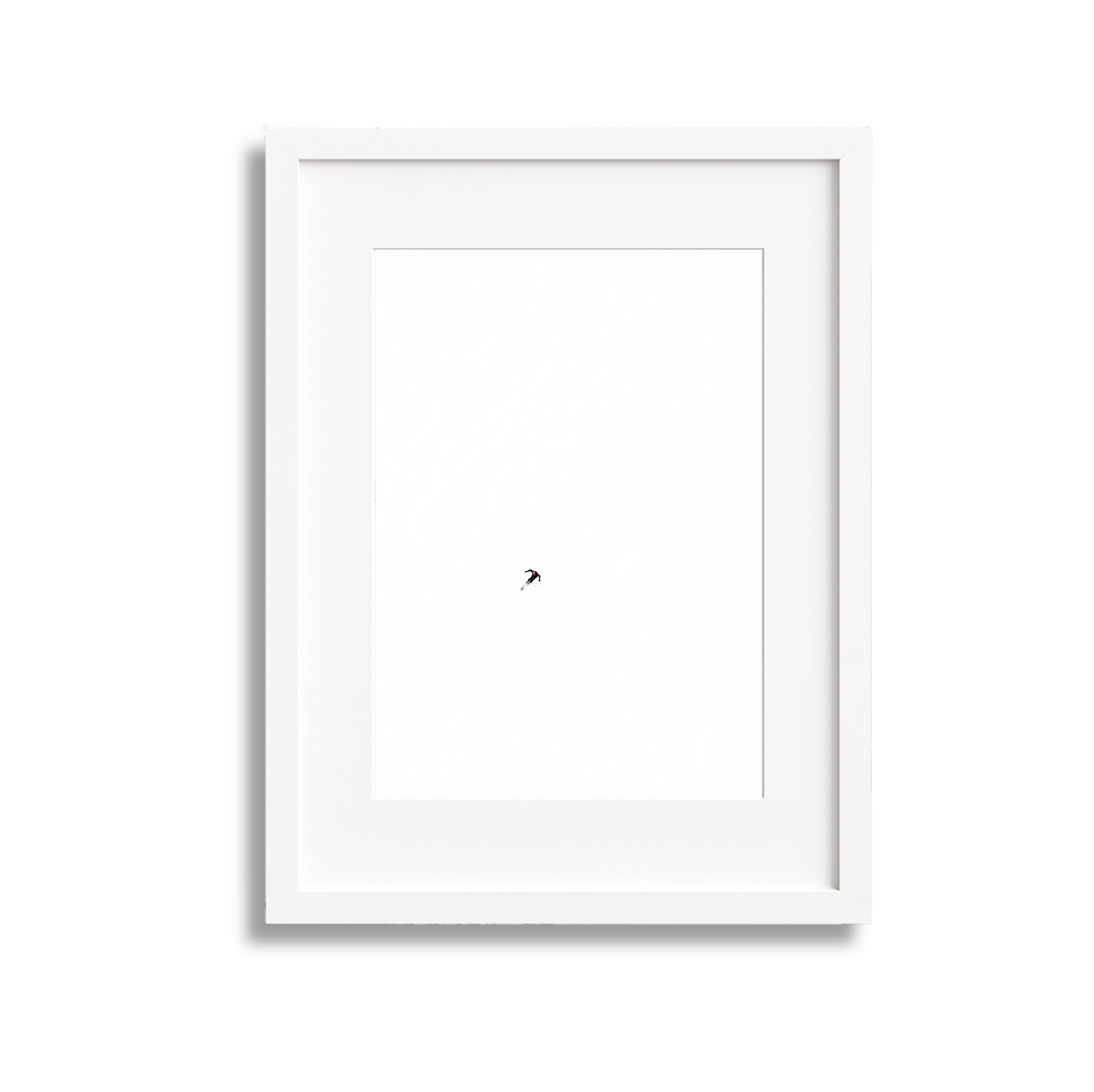 Minimalist white picture frame with an abstract tiny black and red shape in the center.