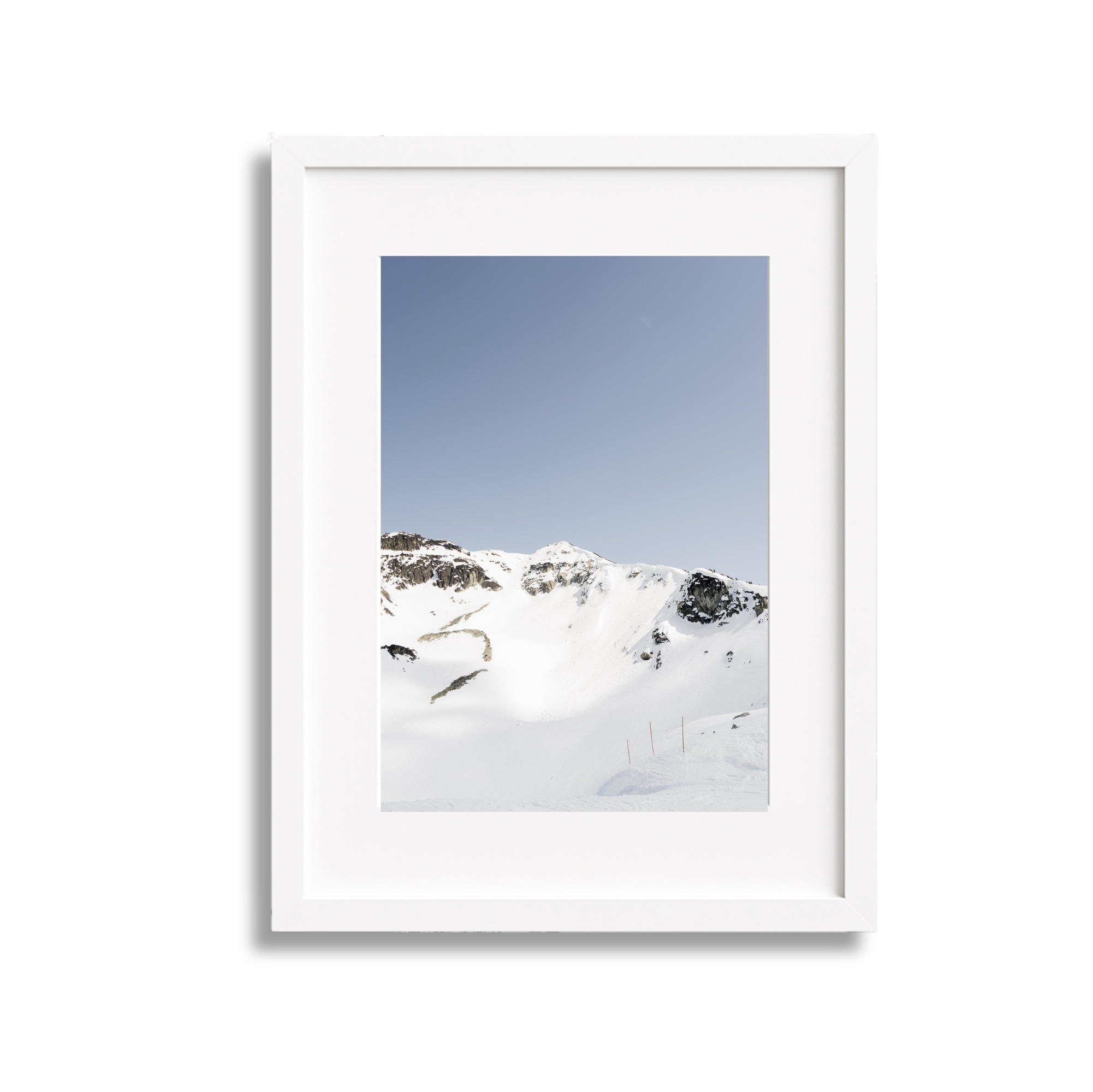 A large framed fine art photography print of the Couloir Extreme on Blackcomb Mountain in Whistler British Columbia Canada. Blue sky and sunshine.