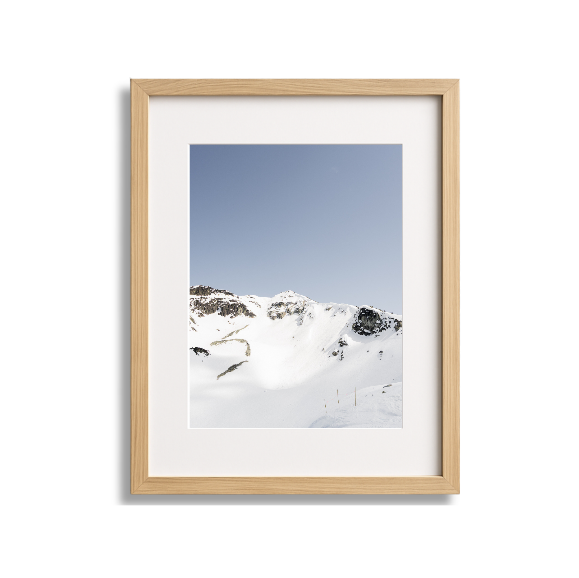 A large framed fine art photography print of the Couloir Extreme on Blackcomb Mountain in Whistler British Columbia Canada. Blue sky and sunshine.
