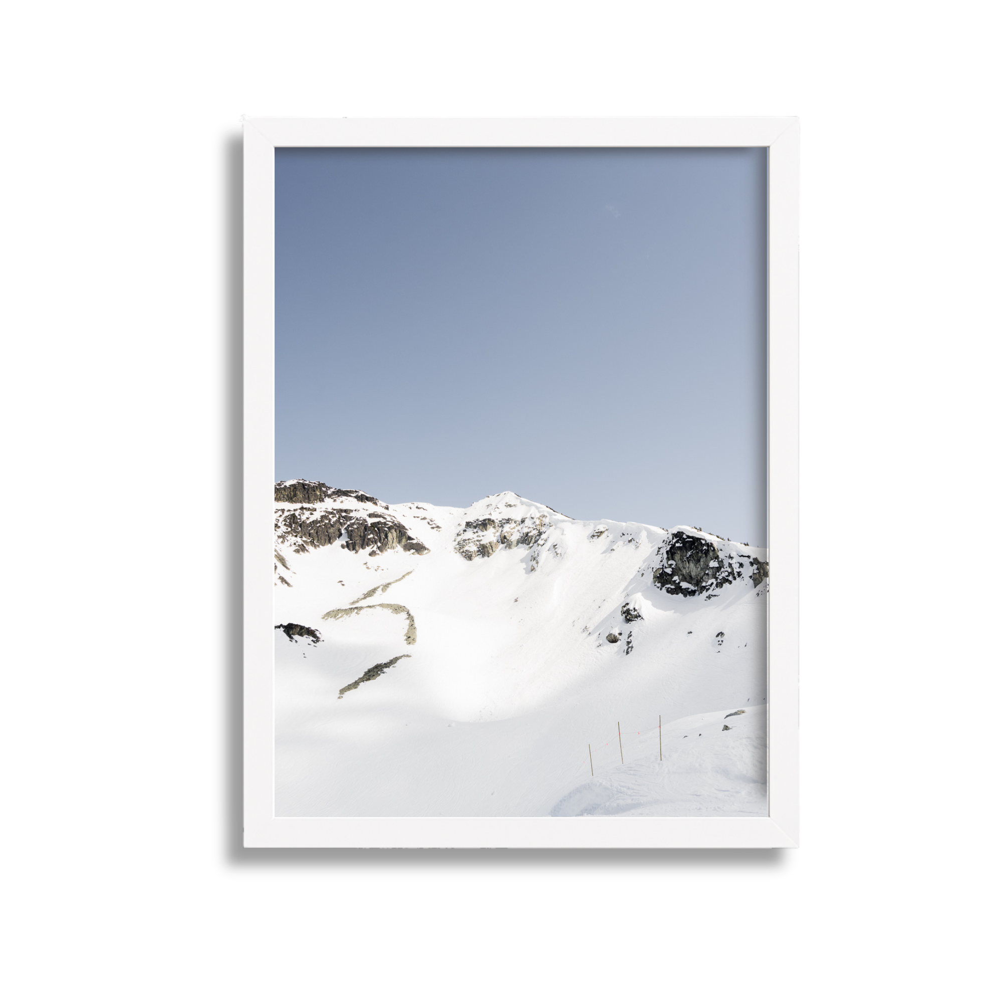 A large framed fine art photography print of the Couloir Extreme on Blackcomb Mountain in Whistler British Columbia Canada. Blue sky and sunshine.
