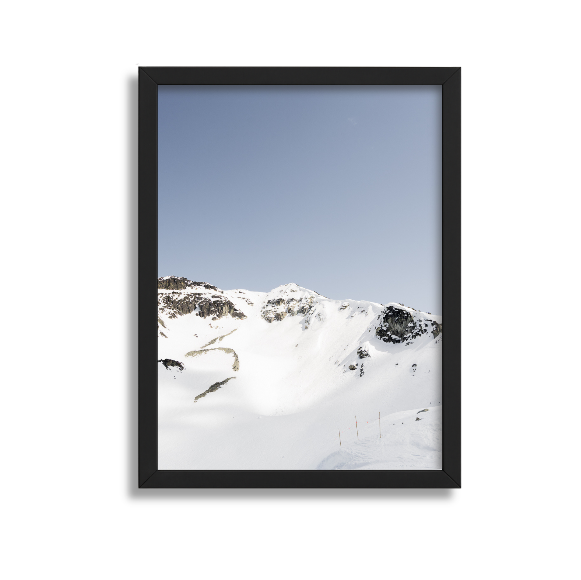 A large framed fine art photography print of the Couloir Extreme on Blackcomb Mountain in Whistler British Columbia Canada. Blue sky and sunshine.