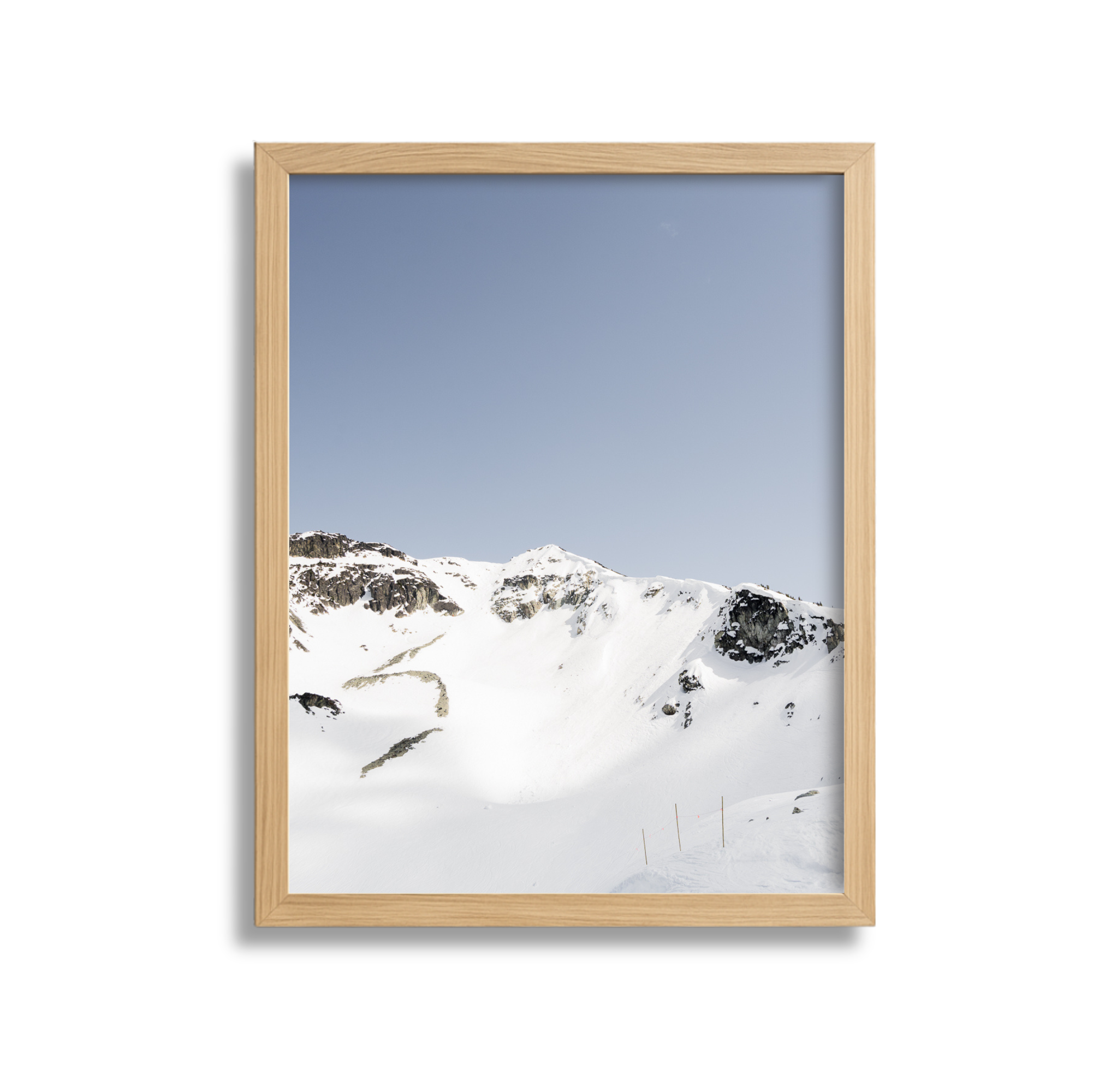 A large framed fine art photography print of the Couloir Extreme on Blackcomb Mountain in Whistler British Columbia Canada. Blue sky and sunshine.