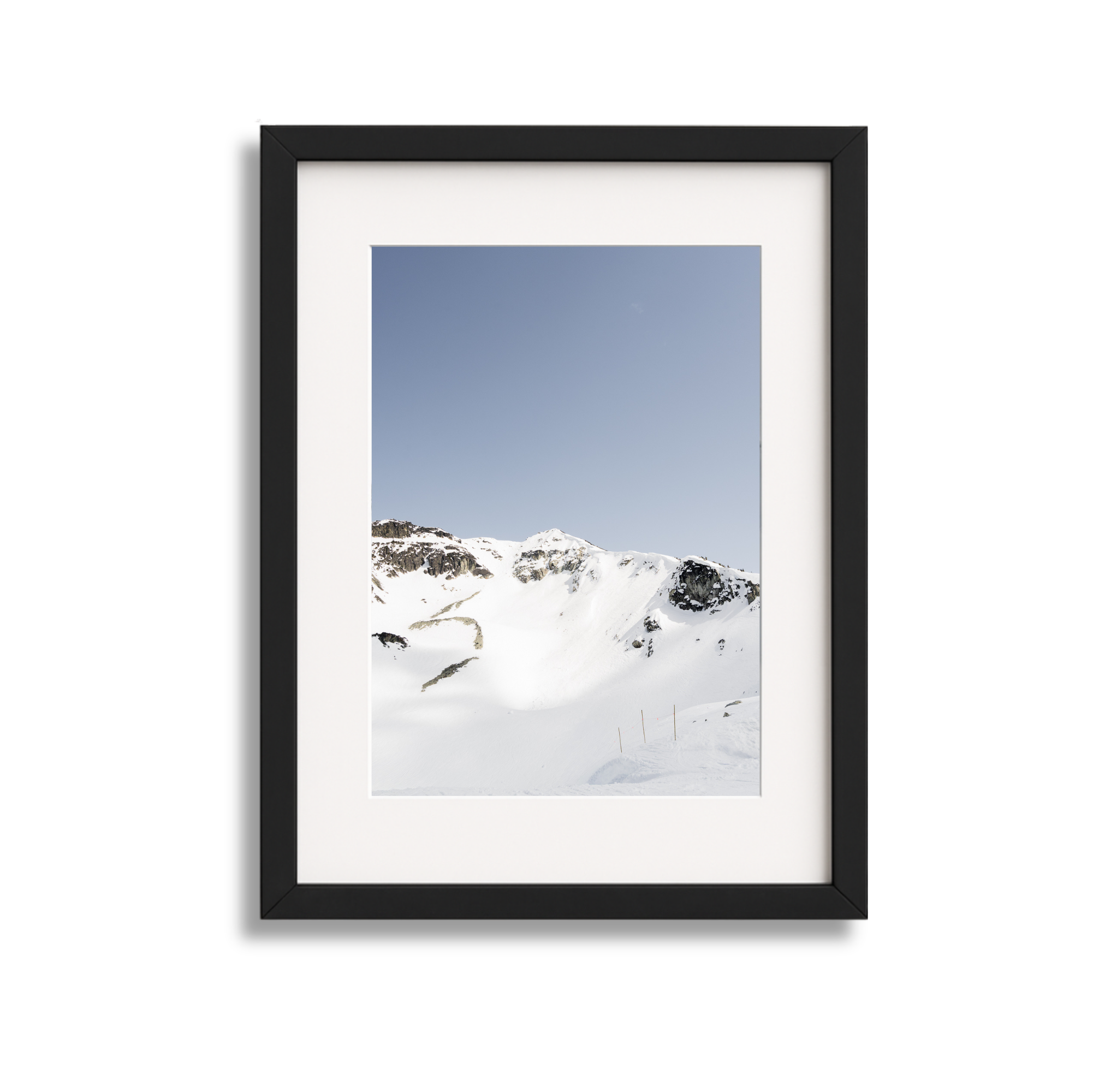 A large framed fine art photography print of the Couloir Extreme on Blackcomb Mountain in Whistler British Columbia Canada. Blue sky and sunshine.