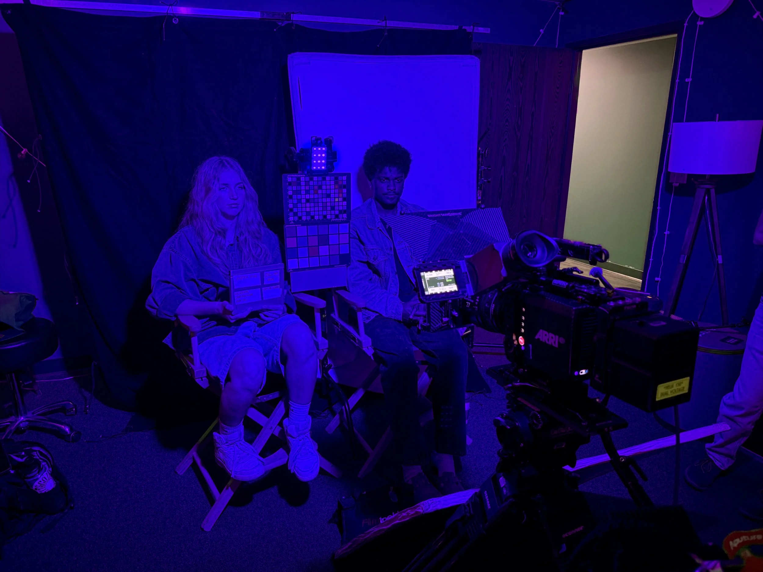 models posing in front of Arri camera in blue lighting for professional LUT color testing