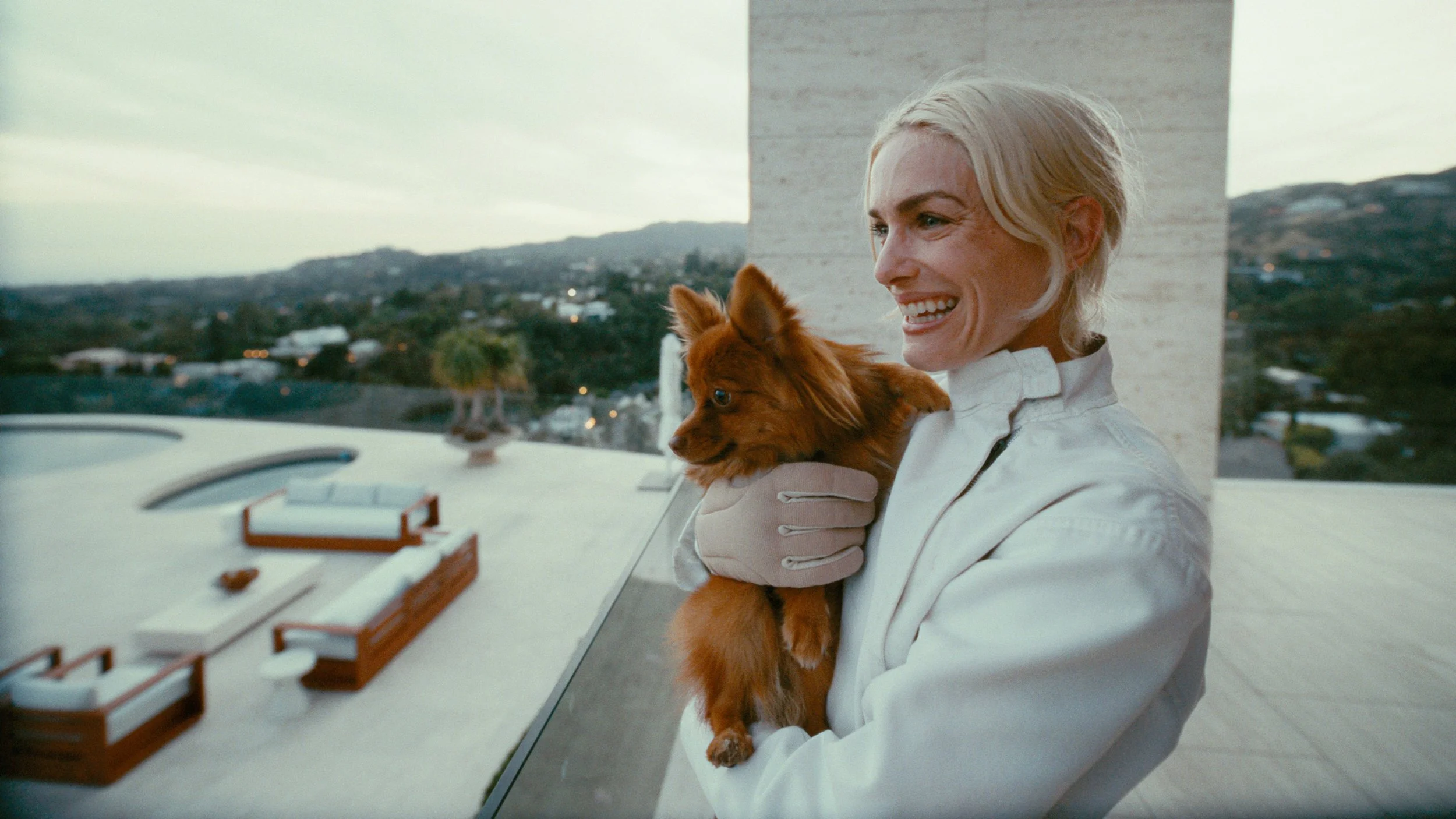 Woman and dog on balcony