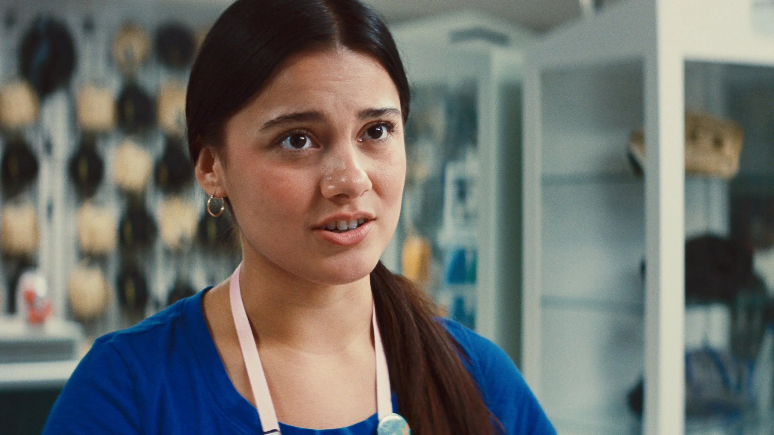 Cashier clerk in blue shirt