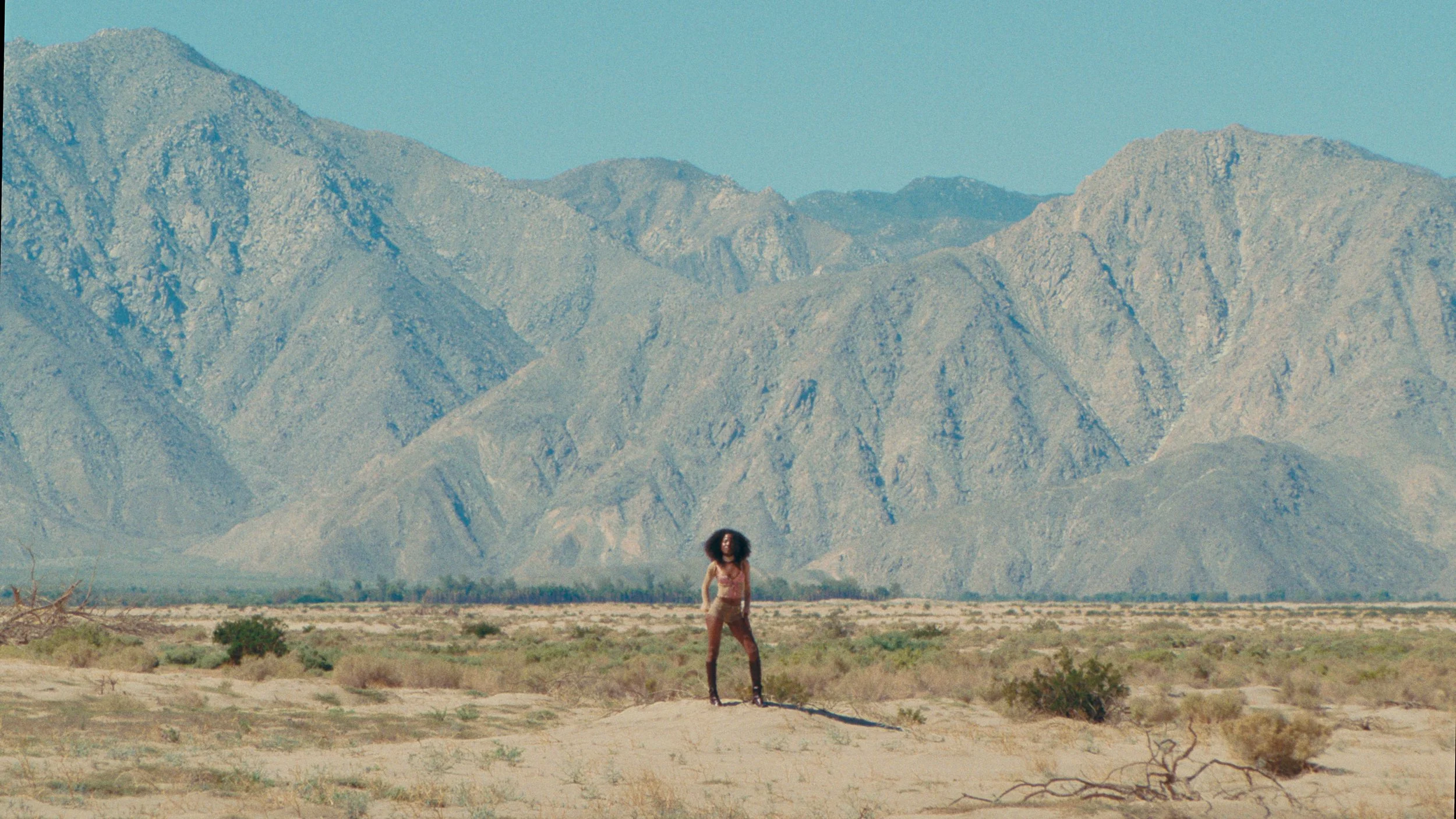 Woman standing in front of mountain