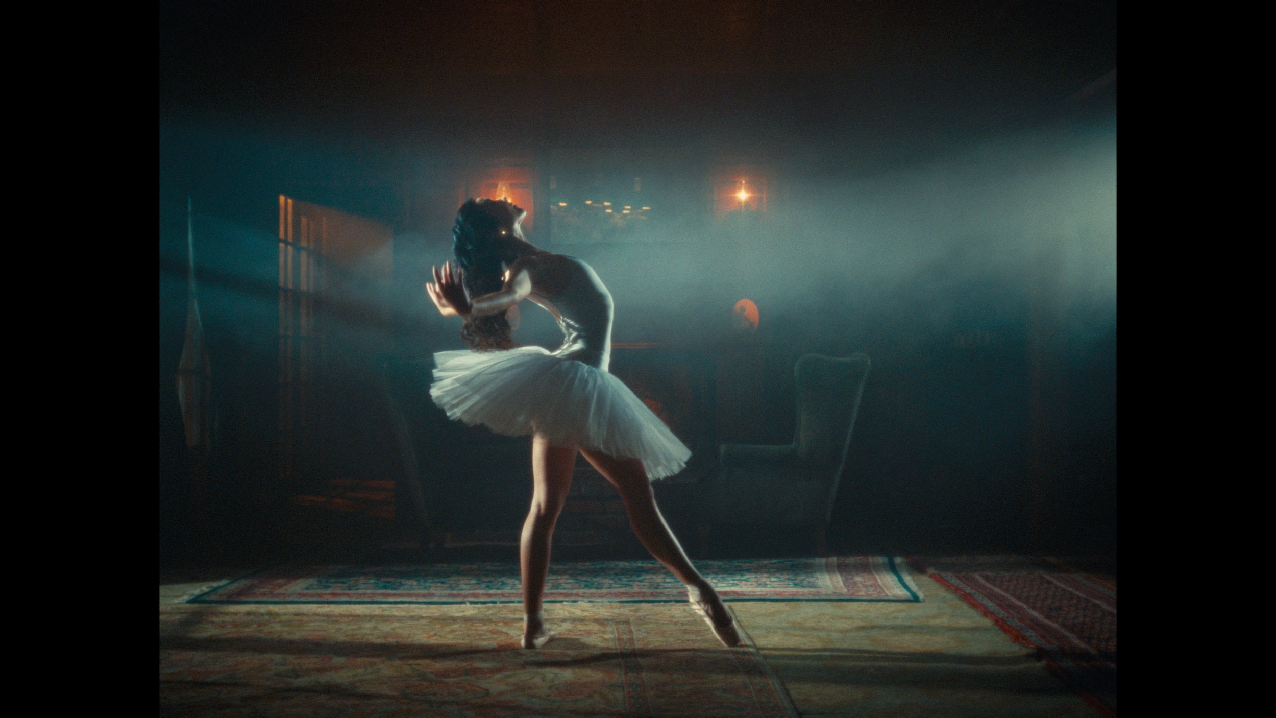 Ballerina dancing in smoky living room
