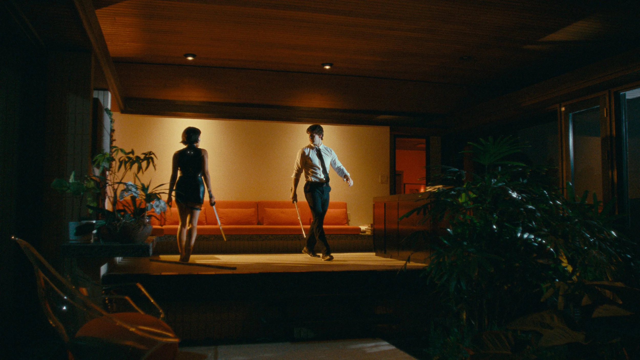 Cinematic scene of man and woman dueling with katana swords, colored with grainy film look