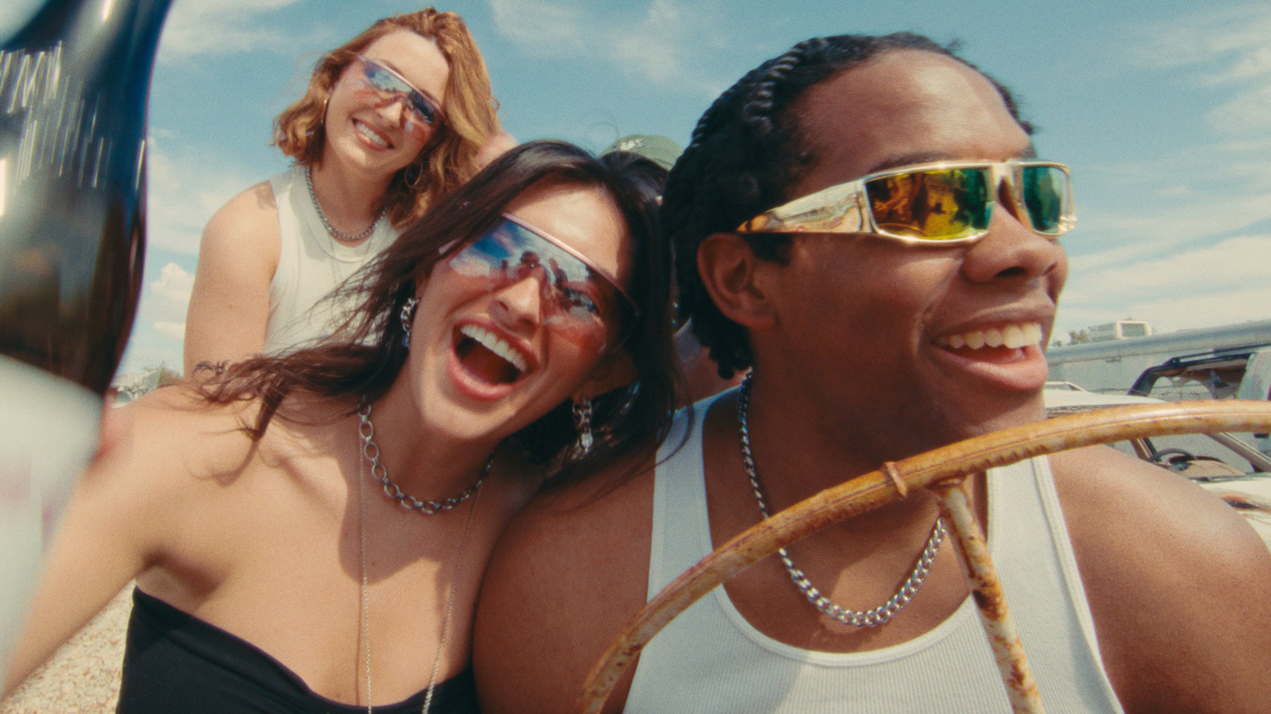 Man and women smiling and having fun in sunny desert colored with warm kodak film look