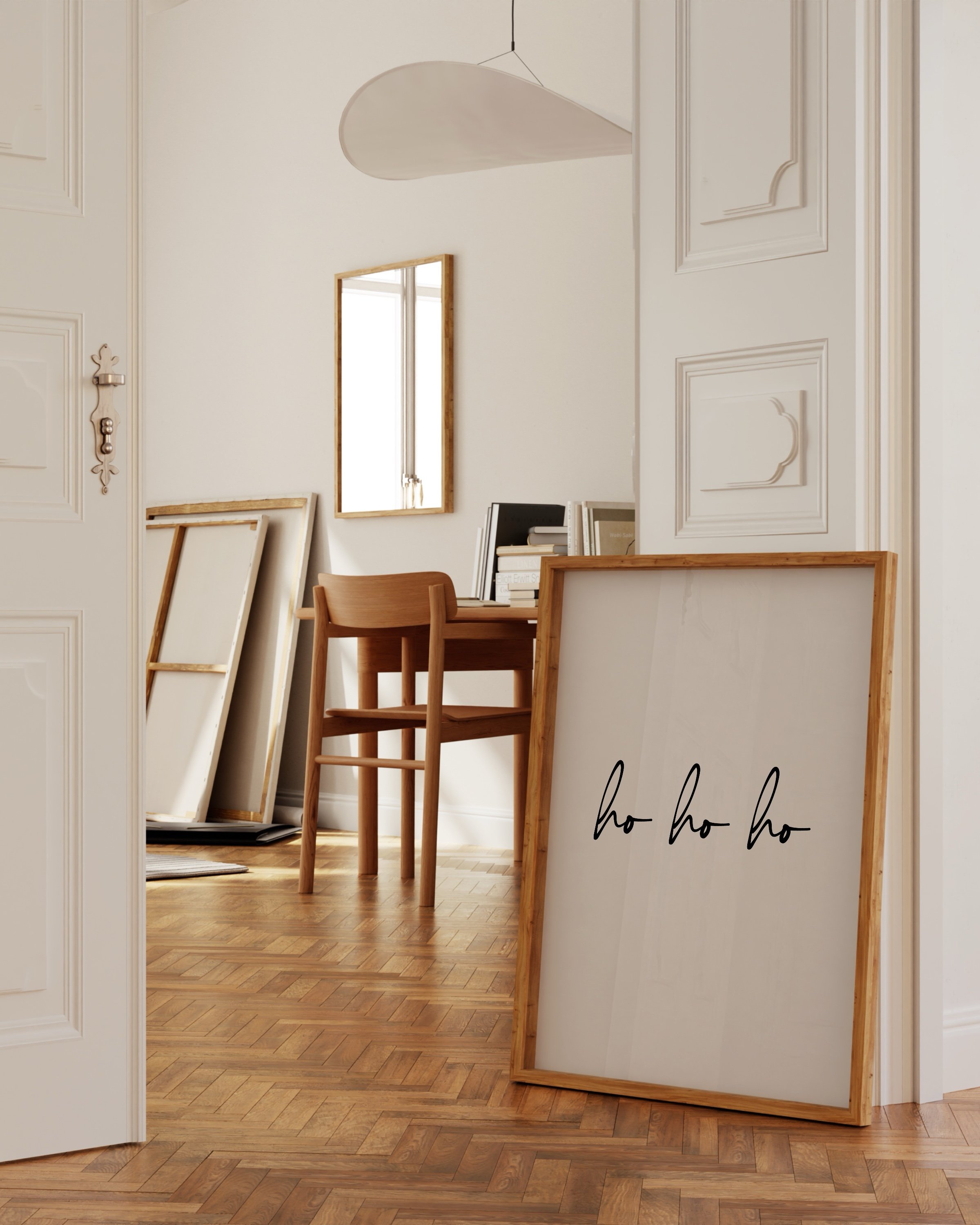 Minimalist “Ho Ho Ho” art print in black script on a white background, perfect for holiday decor.