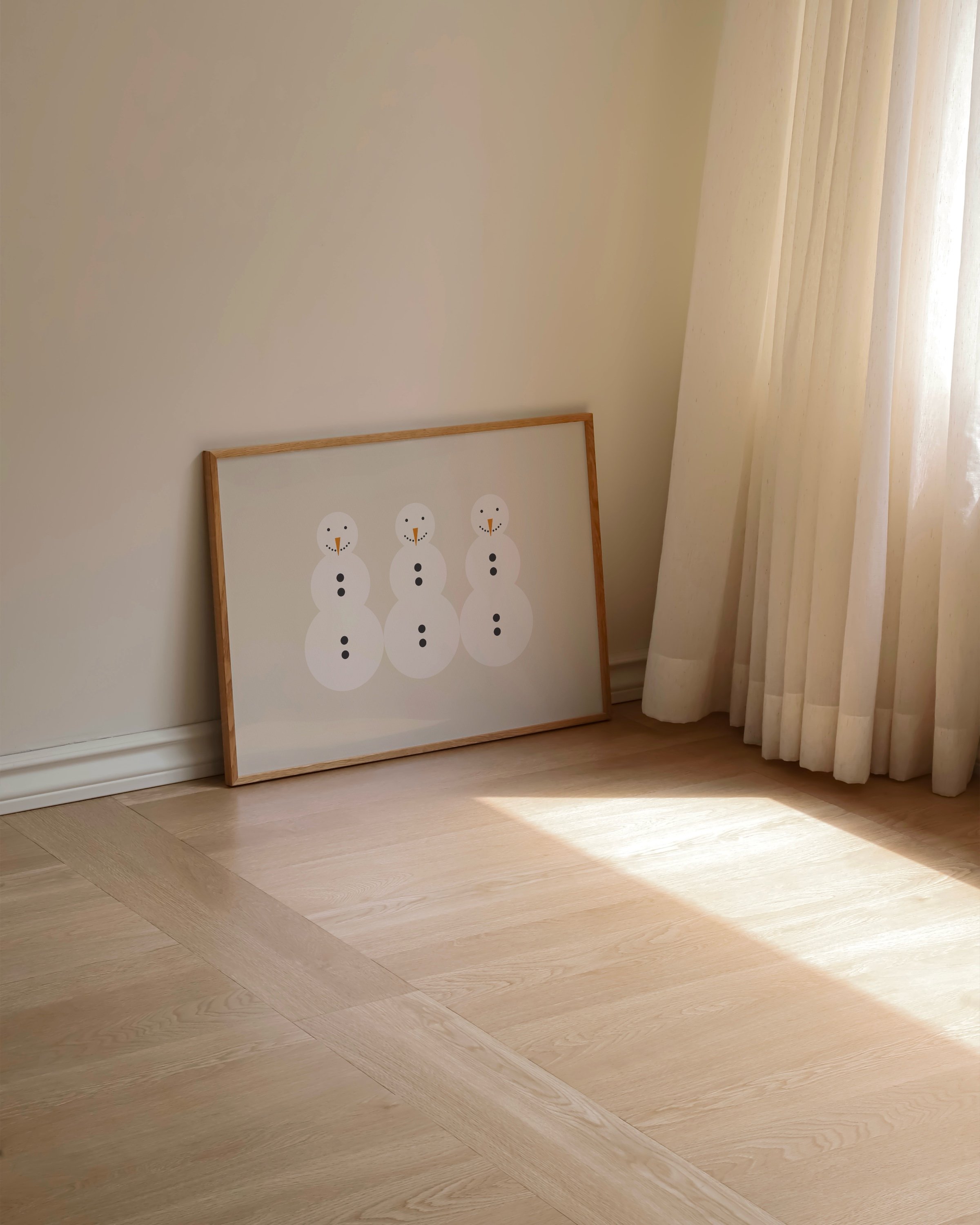 Minimalist snowman art print featuring three snowmen with carrot noses and button details on a beige background.