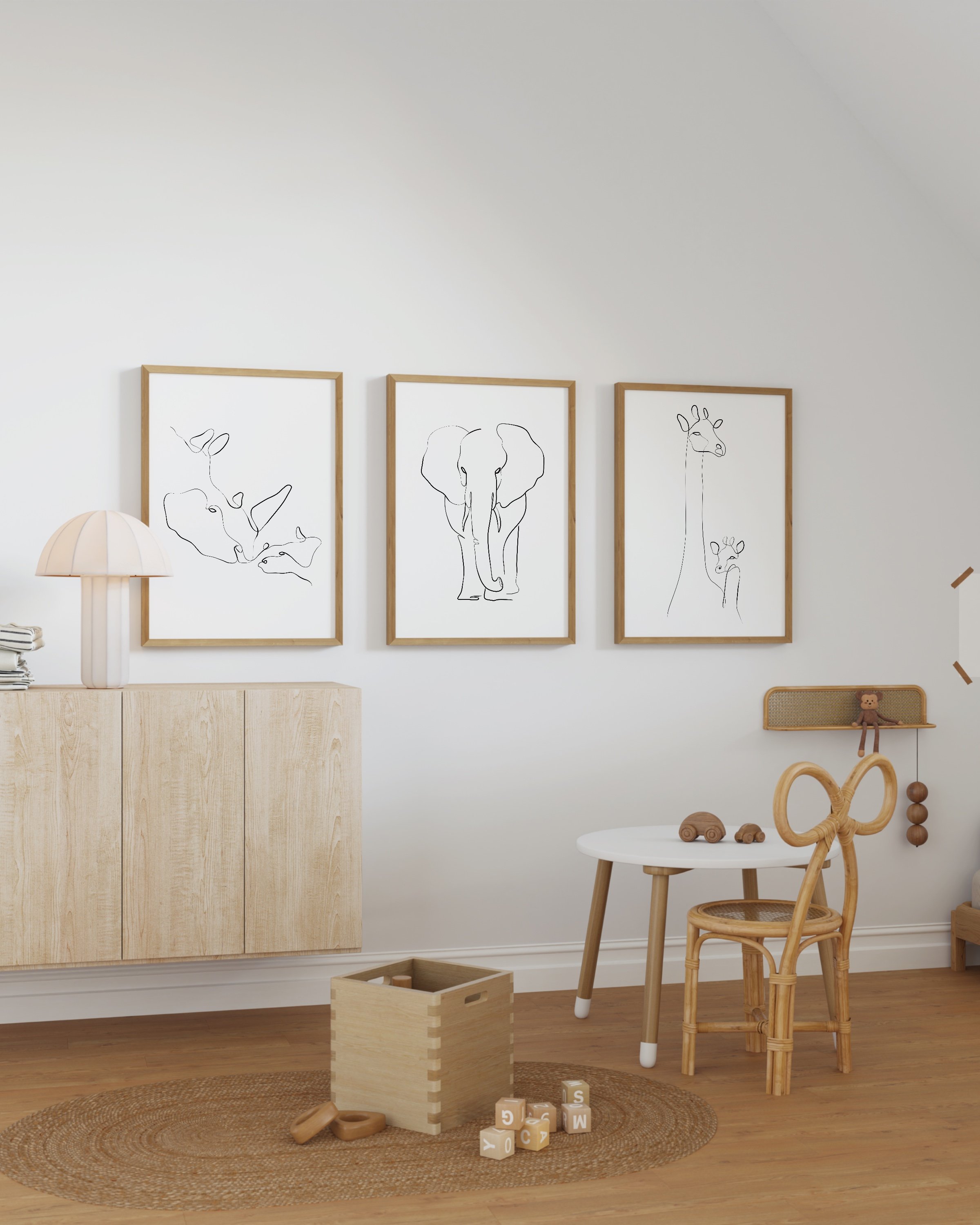 Minimalist black-and-white animal line art prints featuring an elephant, giraffe, and rhino, perfect for adding a modern touch to any space.
