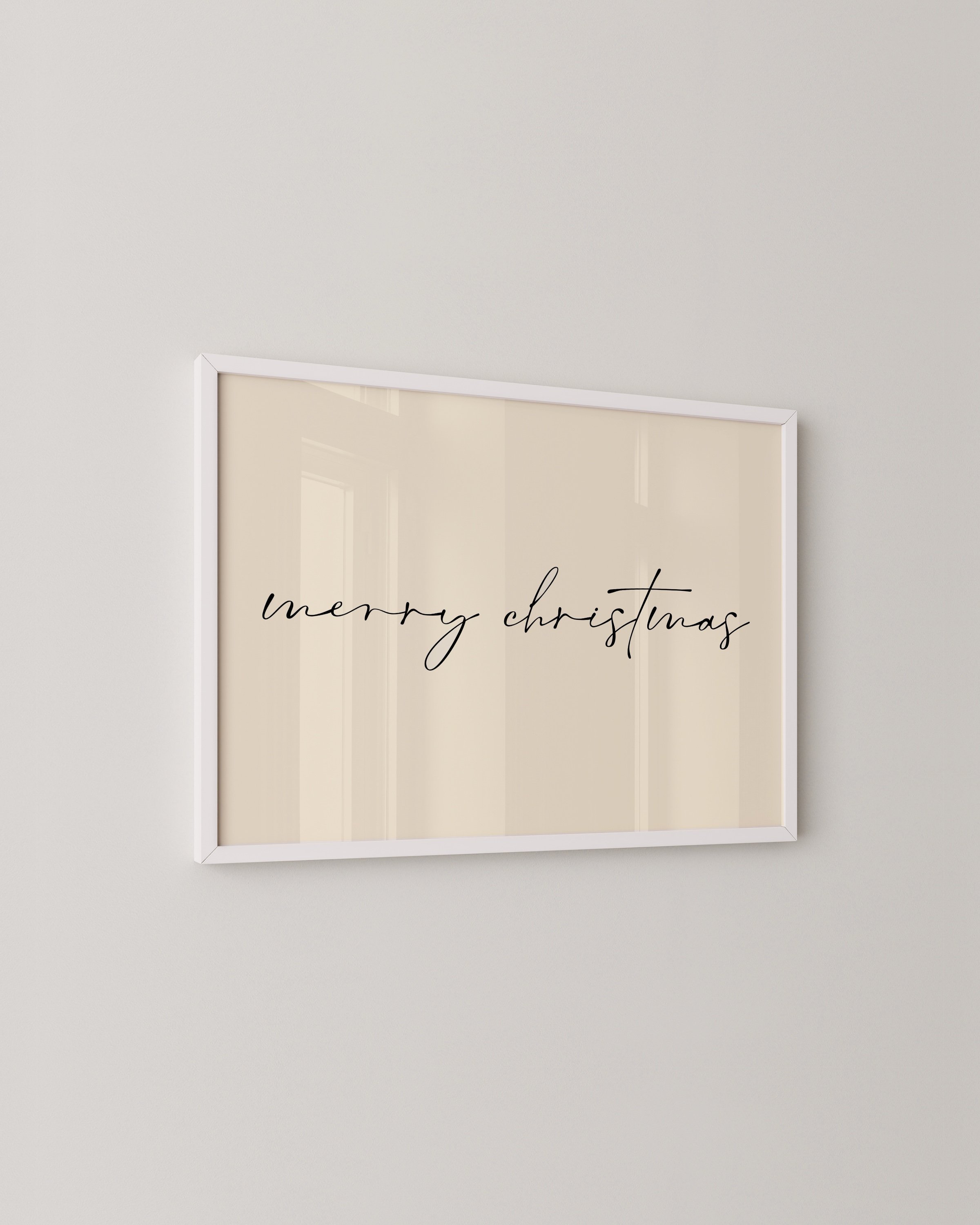 Minimalist Merry Christmas wall art with black calligraphy on a light background