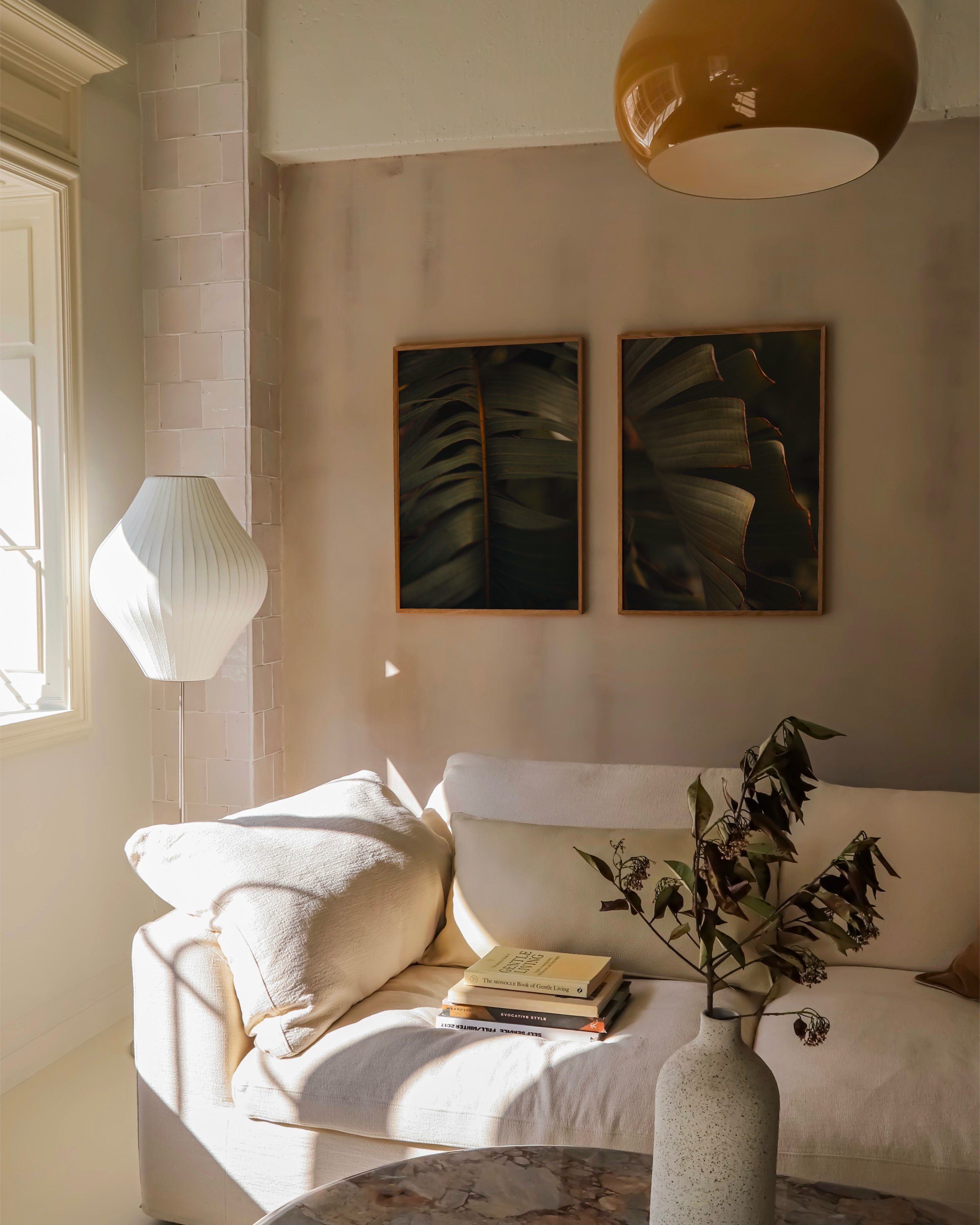 A set of 2 tropical photography prints in a moody deep green tone with light shining on parts of the leaves, macro photography duo, printable wall art.