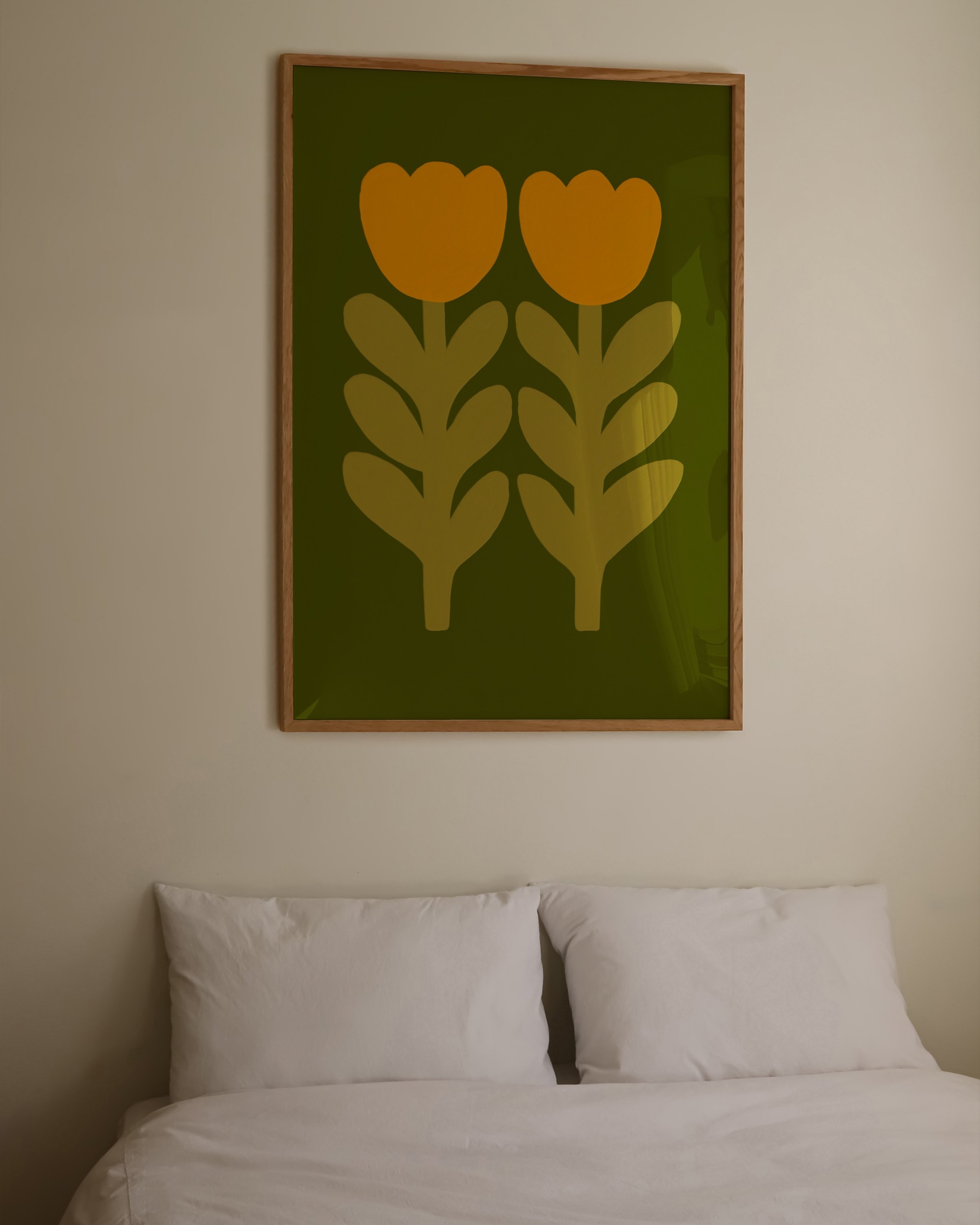 Print of two stylized mustard yellow tulips with leafy stems on an olive green background.