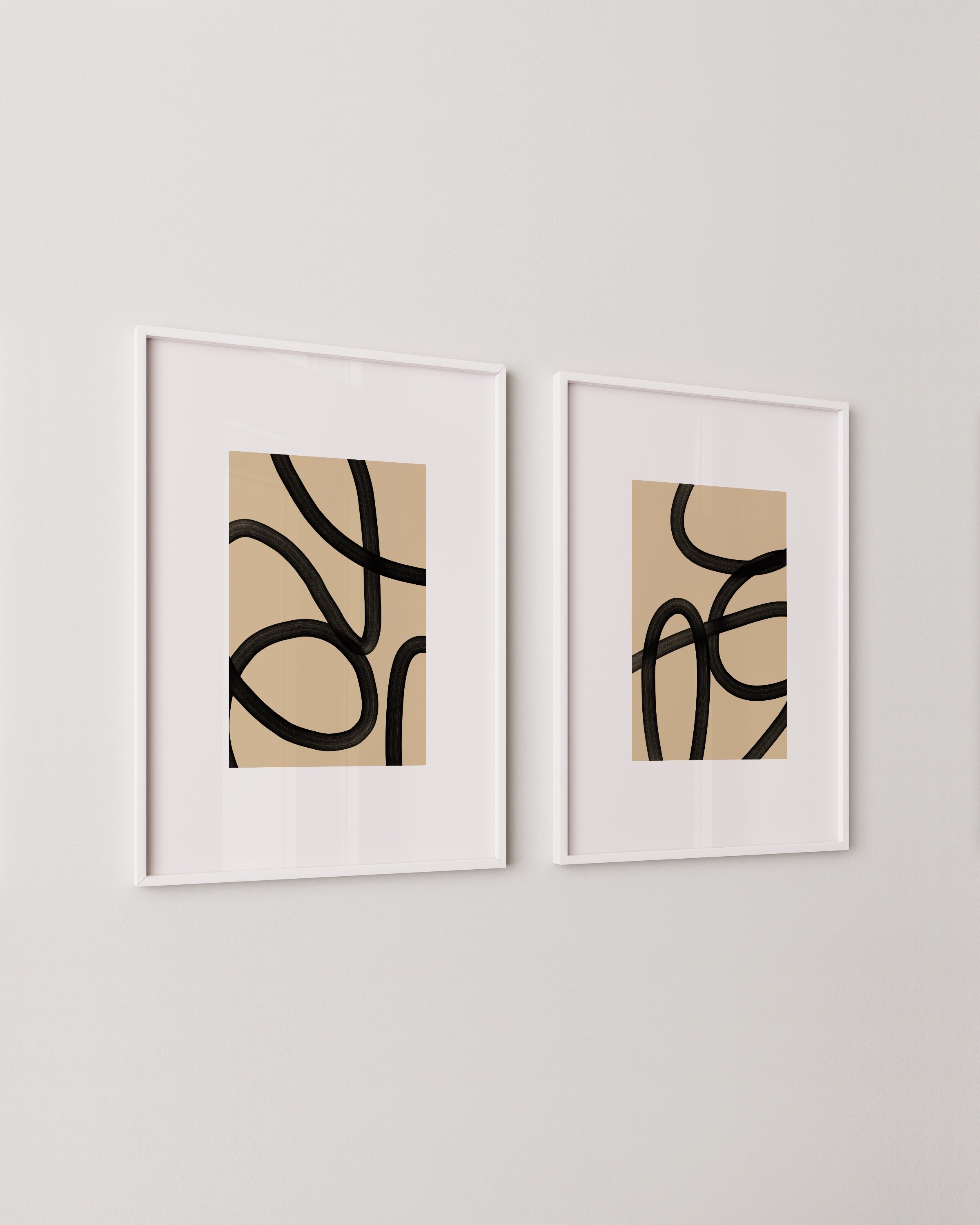 Modern dining room featuring framed abstract art prints in black and beige, enhancing the minimalist decor with contemporary wall art.
