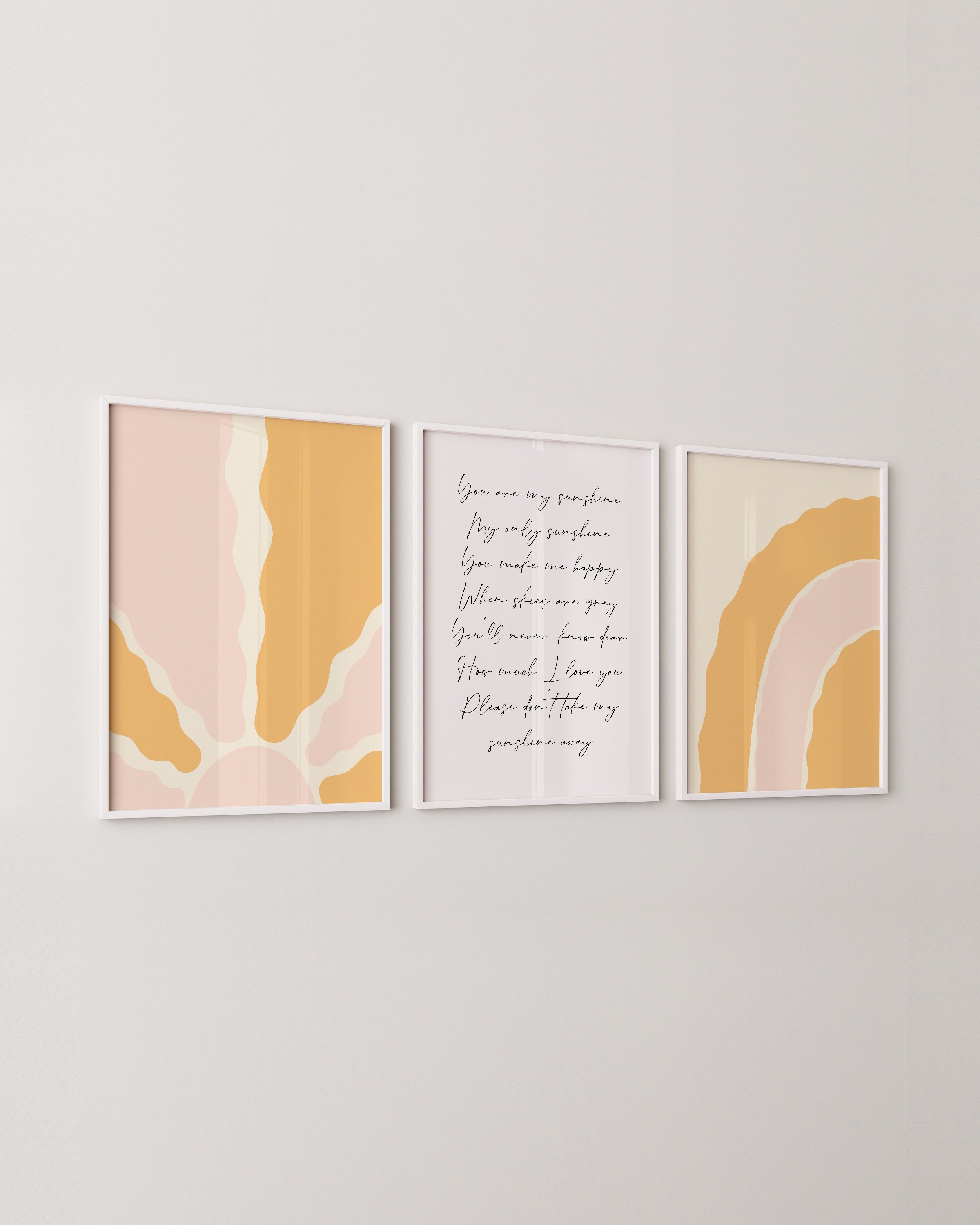 Set of 3 warm-toned prints including a minimalist sunburst, “You Are My Sunshine” lyric, and a soft rainbow design.